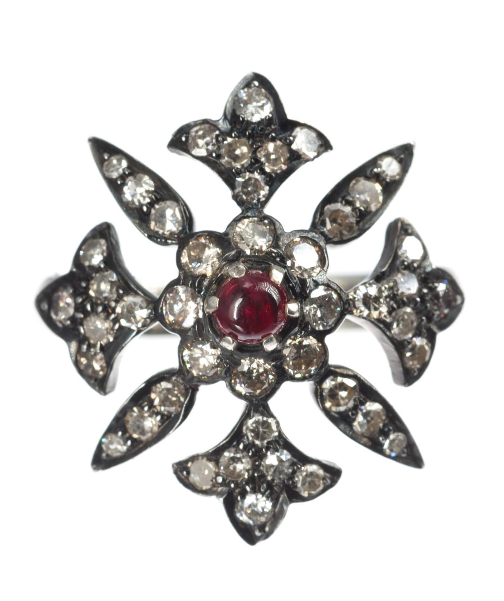 A red cabochon spinel, 3.5mm, is the focal point of this Greek cross ring. Forty-four full- and single-cut round diamonds, 1.55ctw., strike a stunning contrast set against the black-rhodium finished, 14-karat white gold cross. Size 6.5; can be sized.