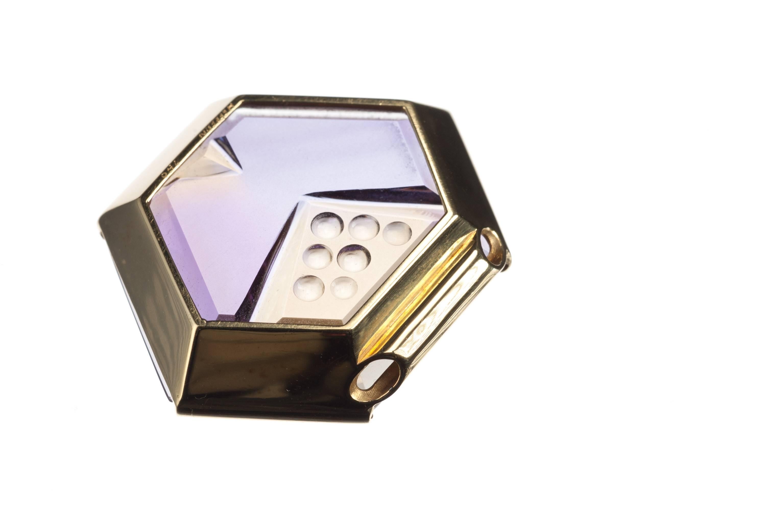 This hexagonal pendant features an enchanting fantasy-cut ametrine cut by renowned gemstone artist Michael Dyber. The gemstone, 48.01ct., is set in an 18-karat yellow gold partial bezel mounting. Chain not included.