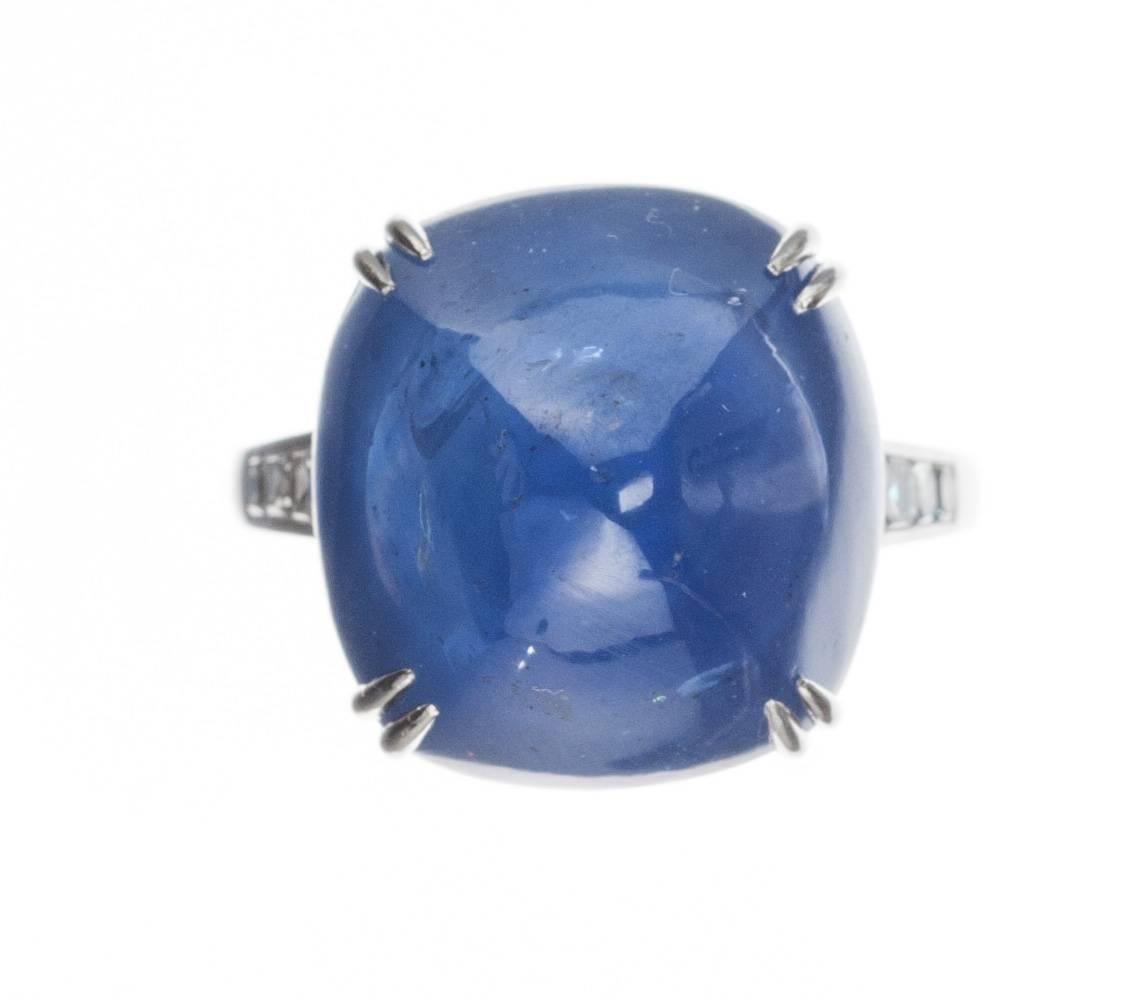 This vintage-inspired platinum ring from designer Lucie Campbell strikes a stunning profile with its sugar loaf-cut sapphire, 27.42ct., and 6 french-cut diamonds, .24ctw. Size 5.75; can be sized. 