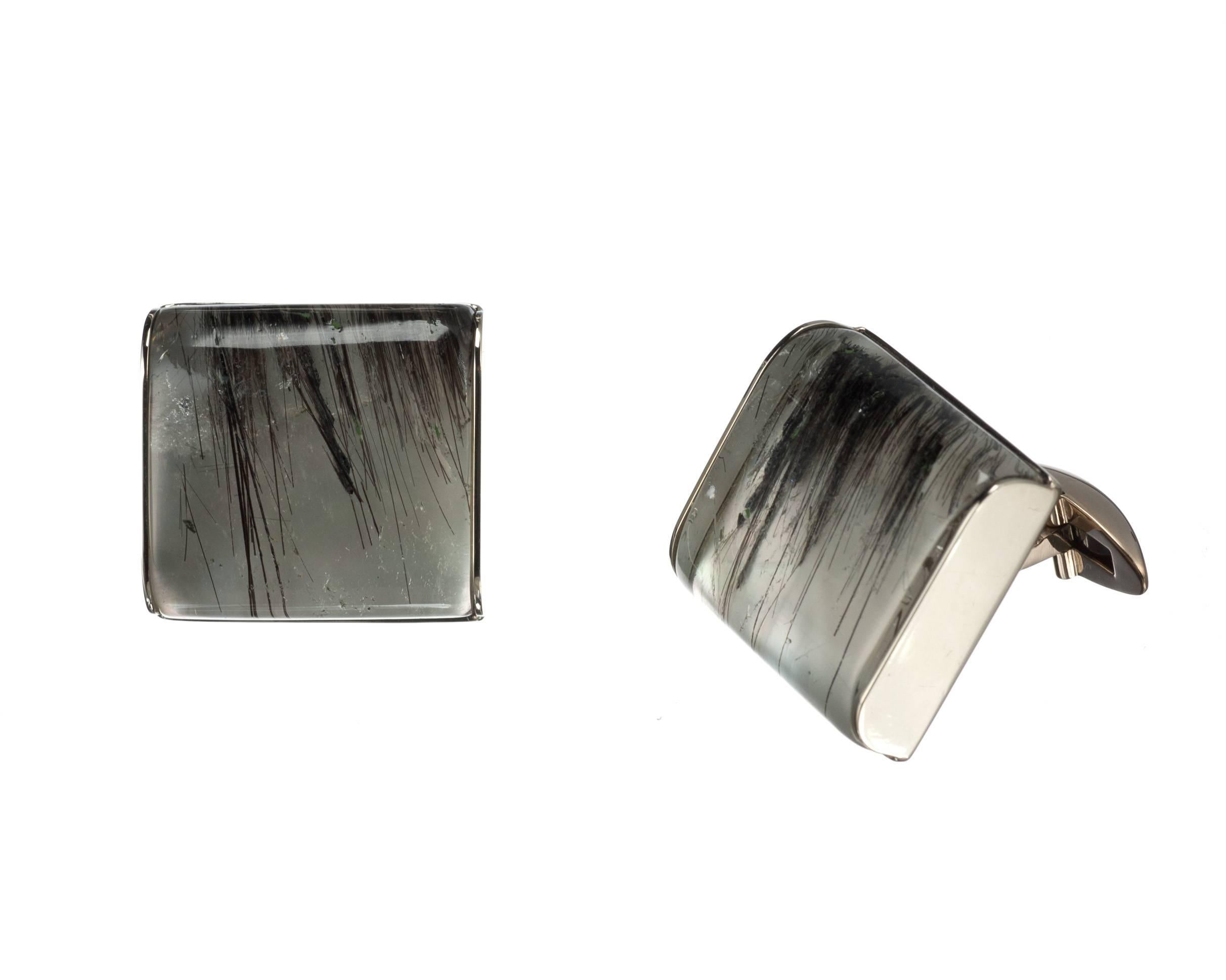Created by Elleard Heffern Fine Jewelers, a pair of 18-karat white gold cufflinks is set with rectangular tourmalinated quartz and mother-of-pearl doublets, approx. 58.37ctw. Each cufflink measures approx. 0.75” square.