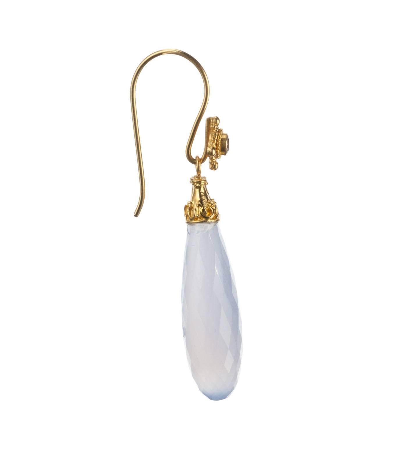 A pair of soft blue chalcedony briolettes, 32.10ctw., are suspended from this pair of 18-karat yellow gold drops earrings. The drops hang lightly from french ear-wires accented with a pair of brilliant-cut round diamonds, .10ctw. of G color and SI