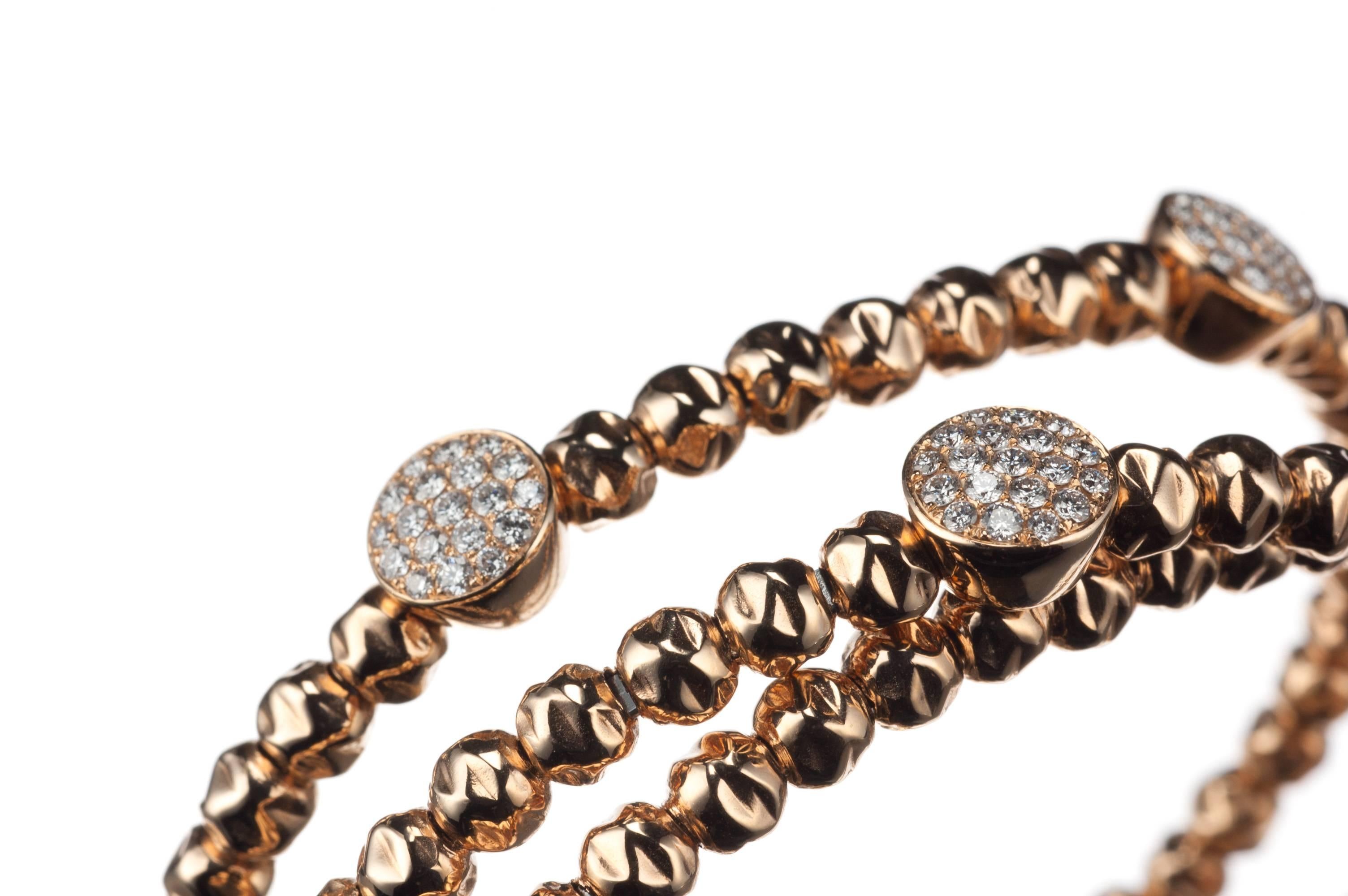 From the Damaso Martinez “Cosmic” collection, a bracelet fashioned in 18-karat rose gold and set with 57 brilliant-cut round diamonds, .74ctw. Made with a tensile substructure, the bracelet is flexible enough to slip on easily and rigid enough to