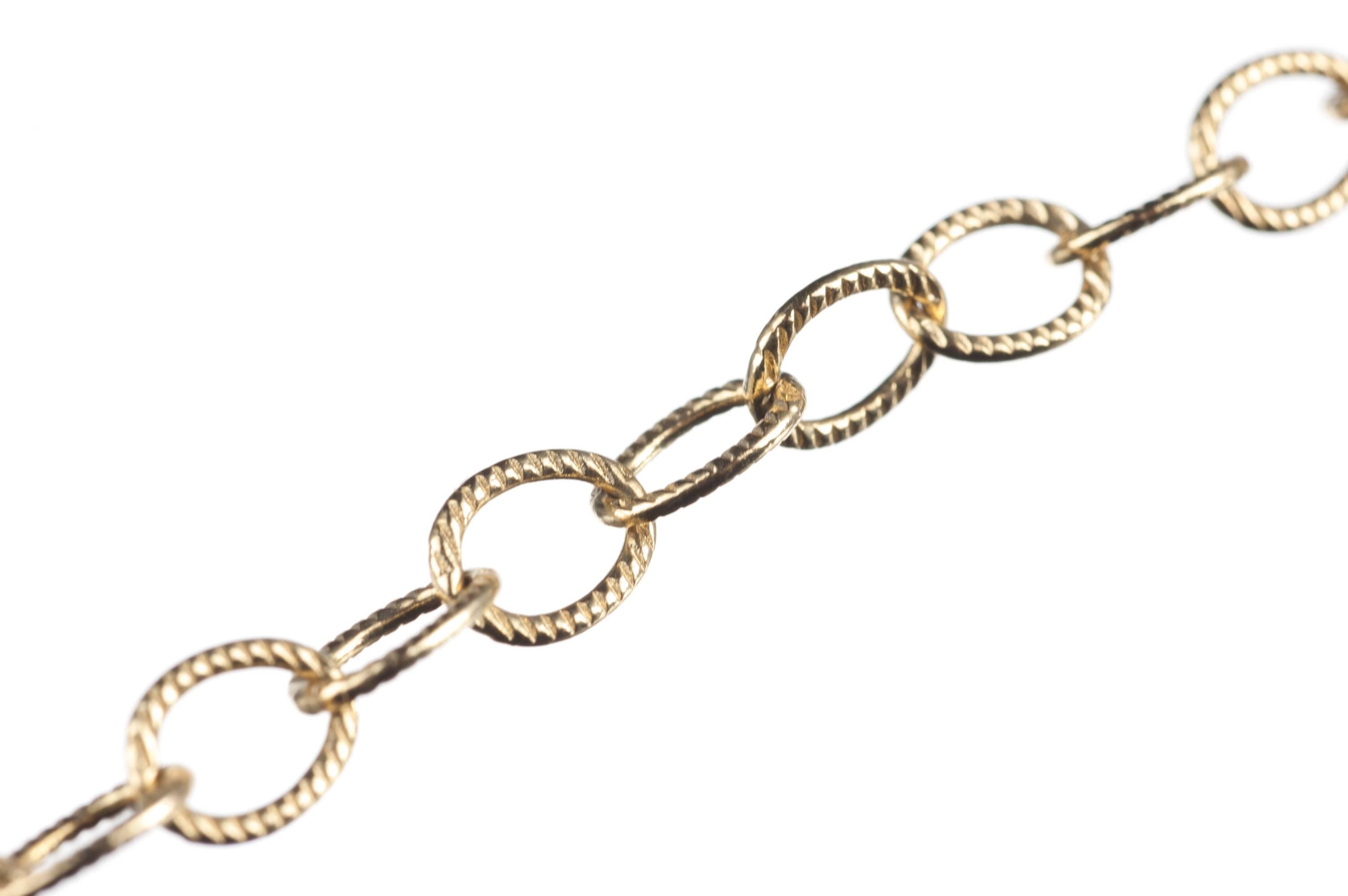 From designer Jude Frances, this 18-karat yellow gold necklace features a large toggle clasp set with 12 brilliant-cut round diamonds, .06ctw. of G color and SI clarity, and a style of textured finish particular to Jude Frances. Necklace measures