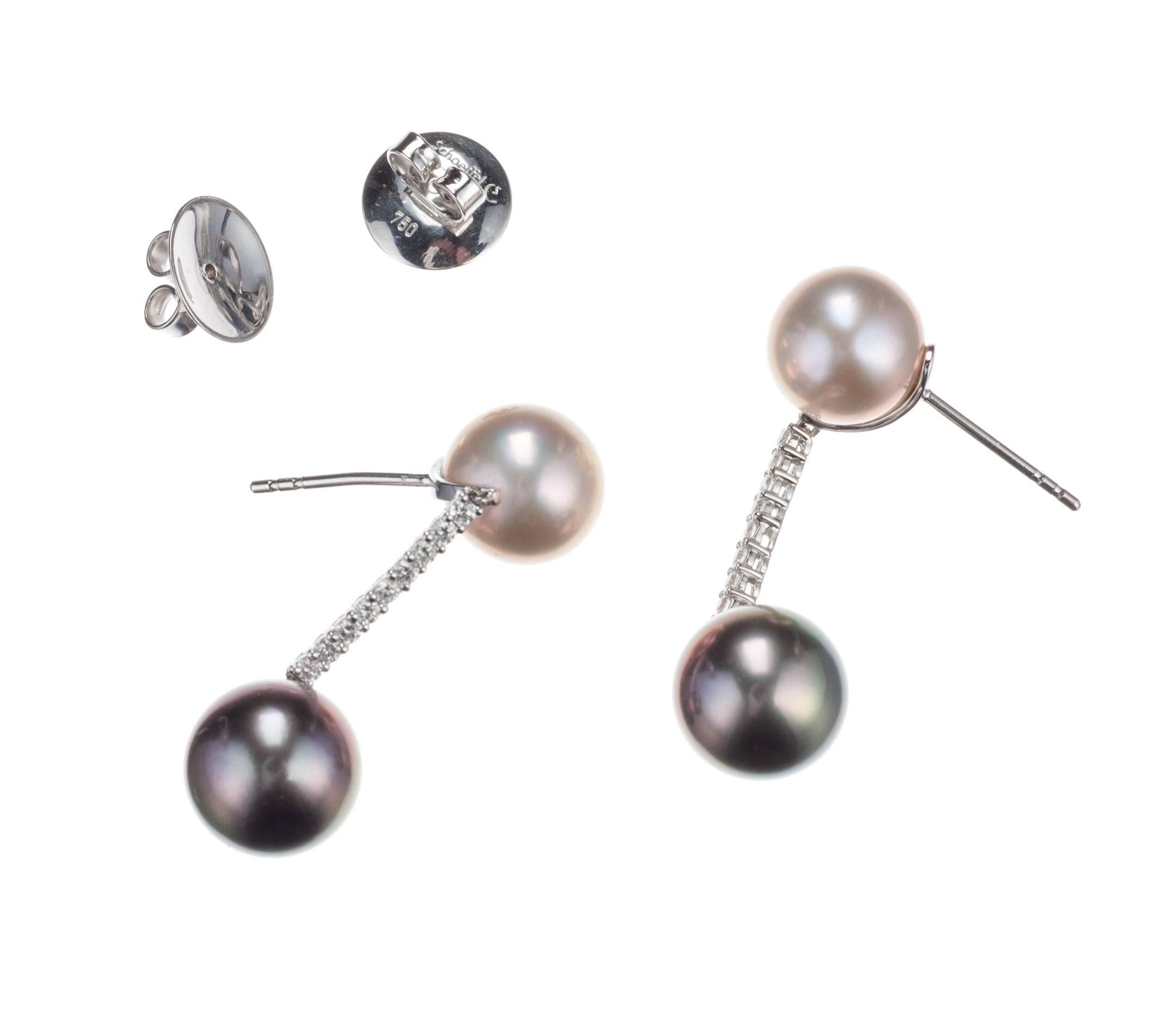 A playful pair of pearl drop earrings, from German designer Schoeffel, are set with one pair of freshwater cultured pearls, approx. 10mm, and one pair of tahitian cultured pearls, approx. 10.5mm. Eighteen brilliant-cut round diamonds, .29ctw. of G
