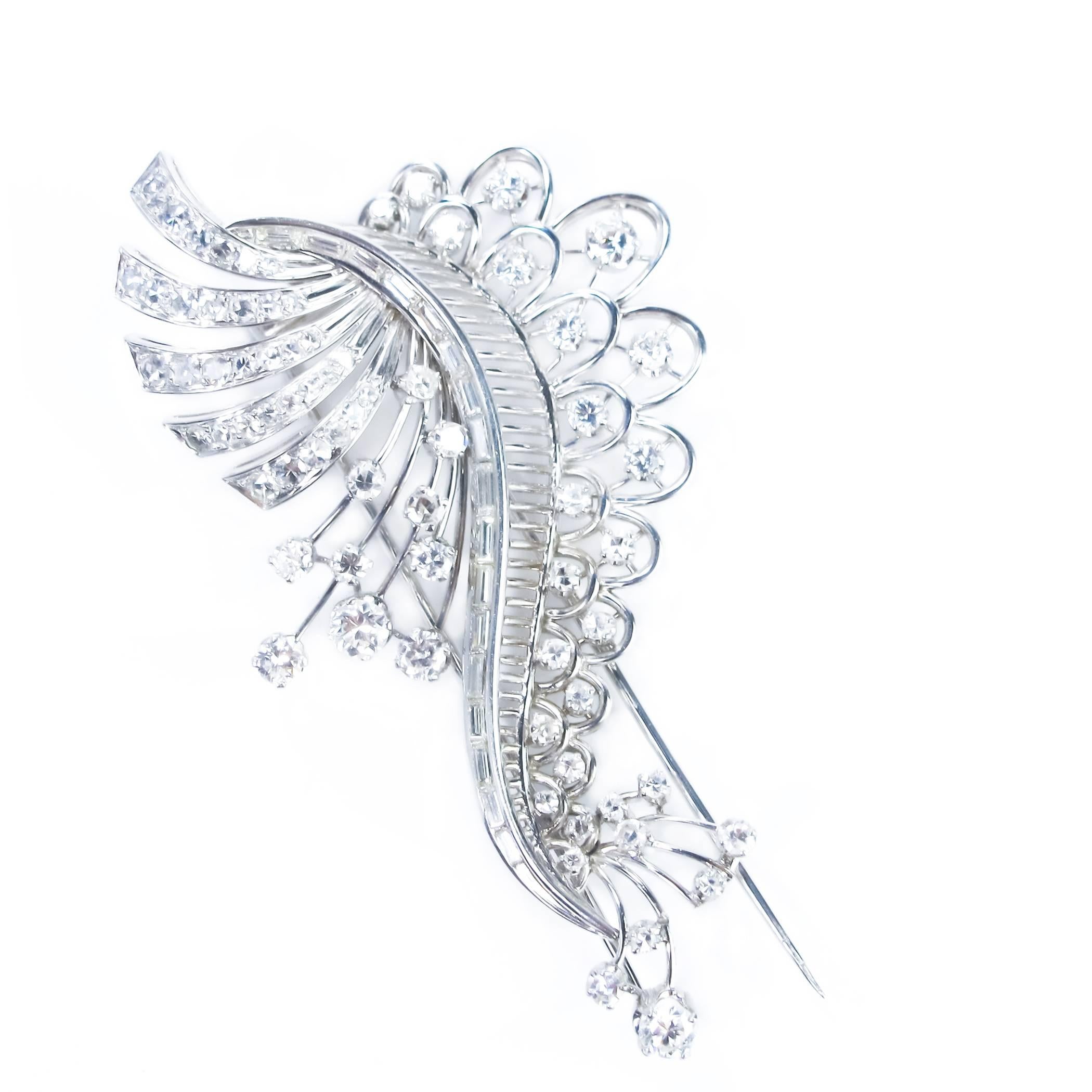 A dramatic 4.01-carat diamond brooch in a beautifully detailed hand crafted Platinum mount. 

There are 90 fancy baguettes, full and single cut rounds in this piece. Mounted on a secure double prong clip

CONDITION:  Excellent with no damage to