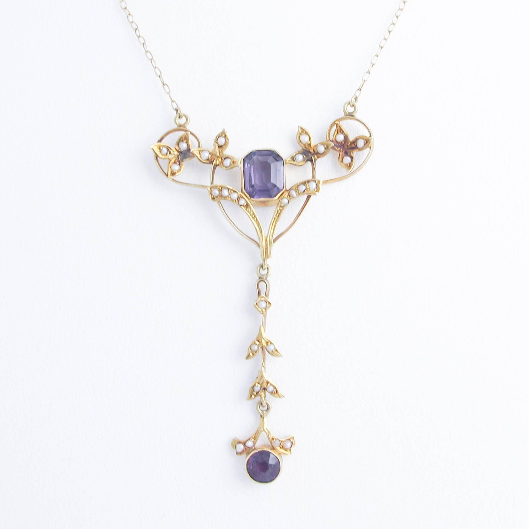 This 19th Century Art Nouveau French Lavaliere was hand crafted and set with Amethysts and natural Silver Gulf Pearls in three articulated sections. 

Wishbone motif is beautifully constructed and the Drop is elegant and impressive. The