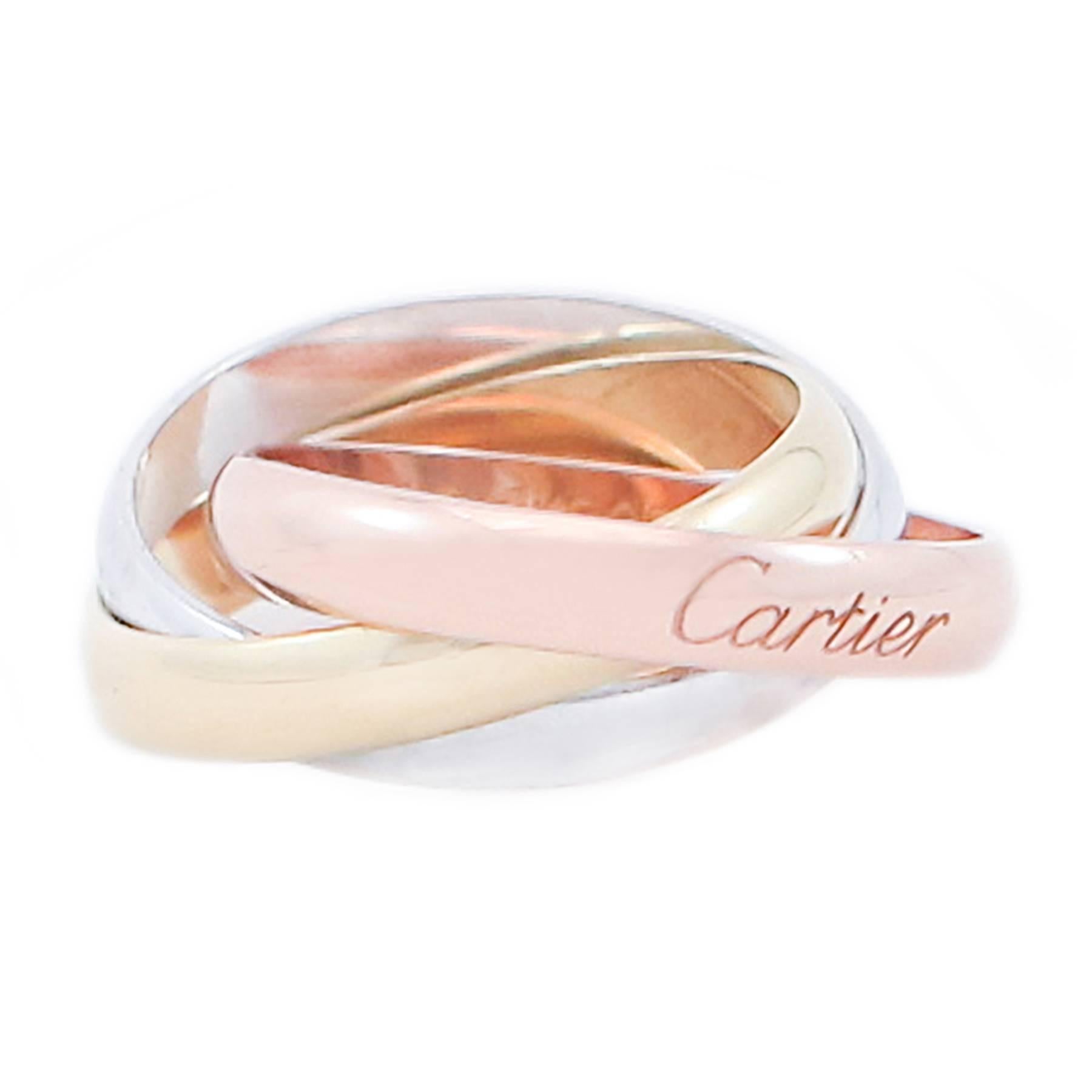 This is Cartier's Classic Trinity Ring in 3 colors of 18K gold. A French size 54 equating to 6 3/4 American (this ring should not be sized).

The Trinity was the vision of Louis Cartier who created it in 1924 and  presented it to the artist and