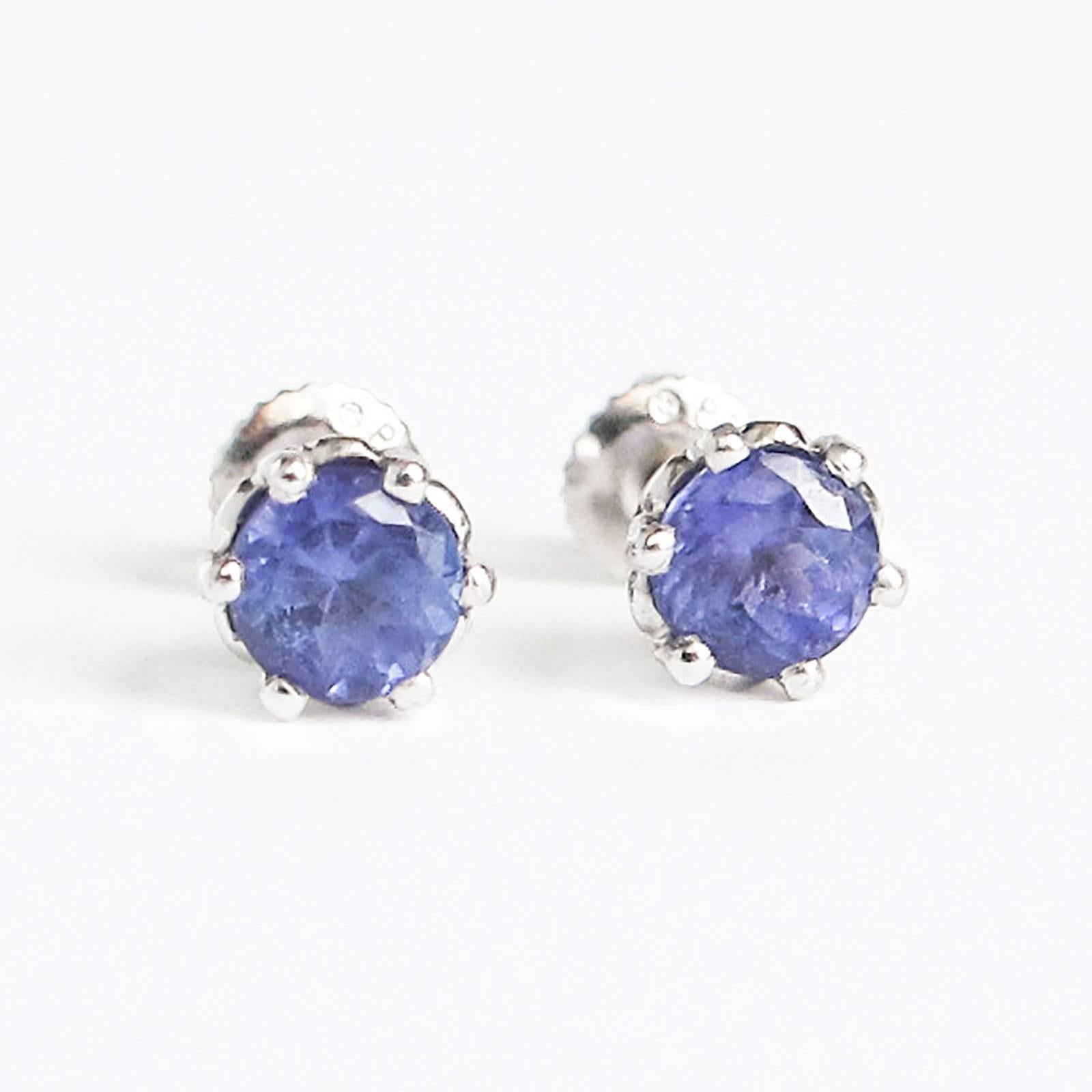 Stunning Platinum stud earrings are set with natural Tanzanite gemstones measuring 5.85mm x 3.80mm (nominal average) total 1.75 carat by gauge and formula.

The Tanzanites are round, mixed cut and well matched. Very nicely mounted in Platinum cups