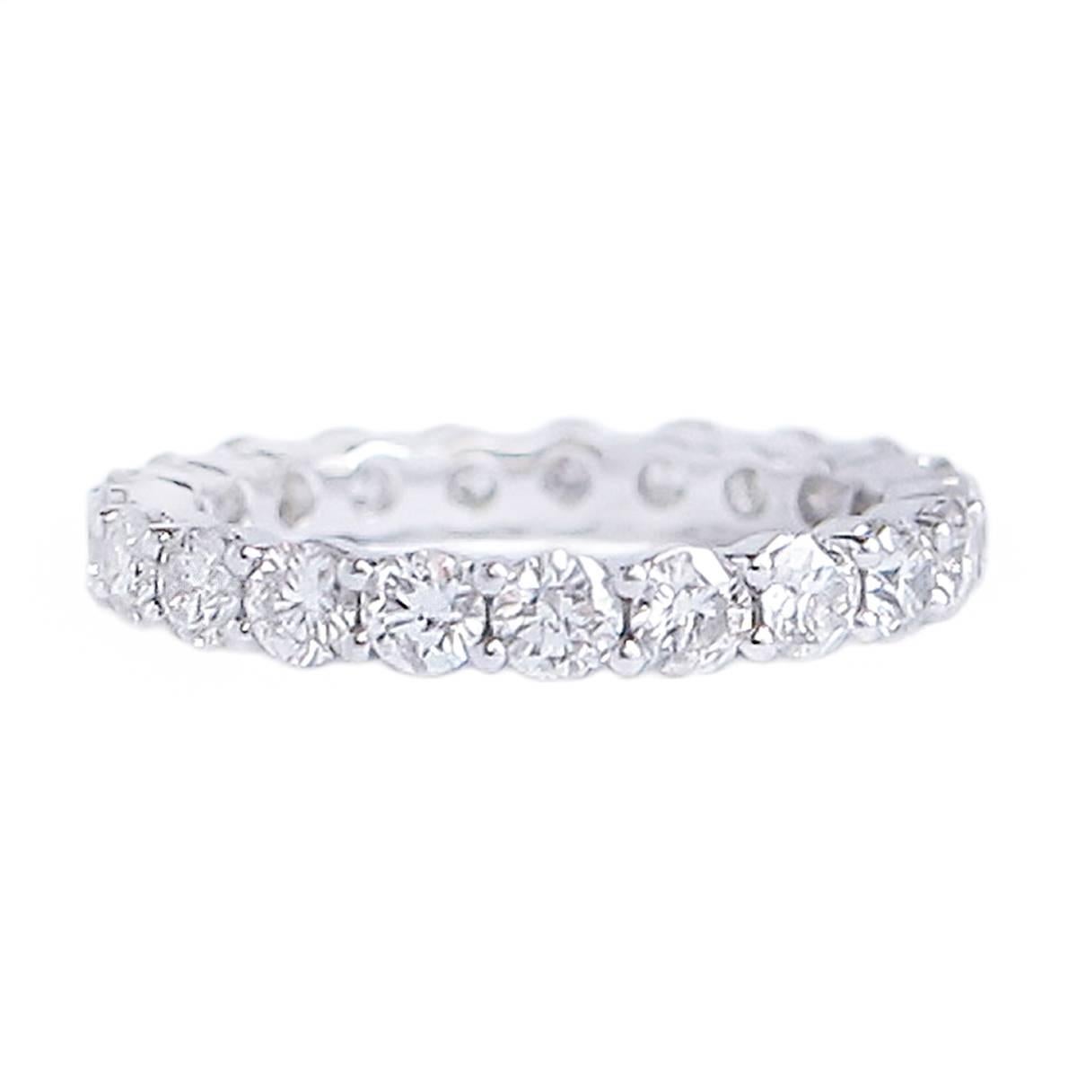 This classic 2.31 Carat Diamond Eternity Band is set in 18 Karat white gold. 

The twenty-one G-H Color clear Diamonds are round, Brilliant Cut and hand set in the shared claw fashion. It measures 4.8 mm across and is an American size 7. (Full gem