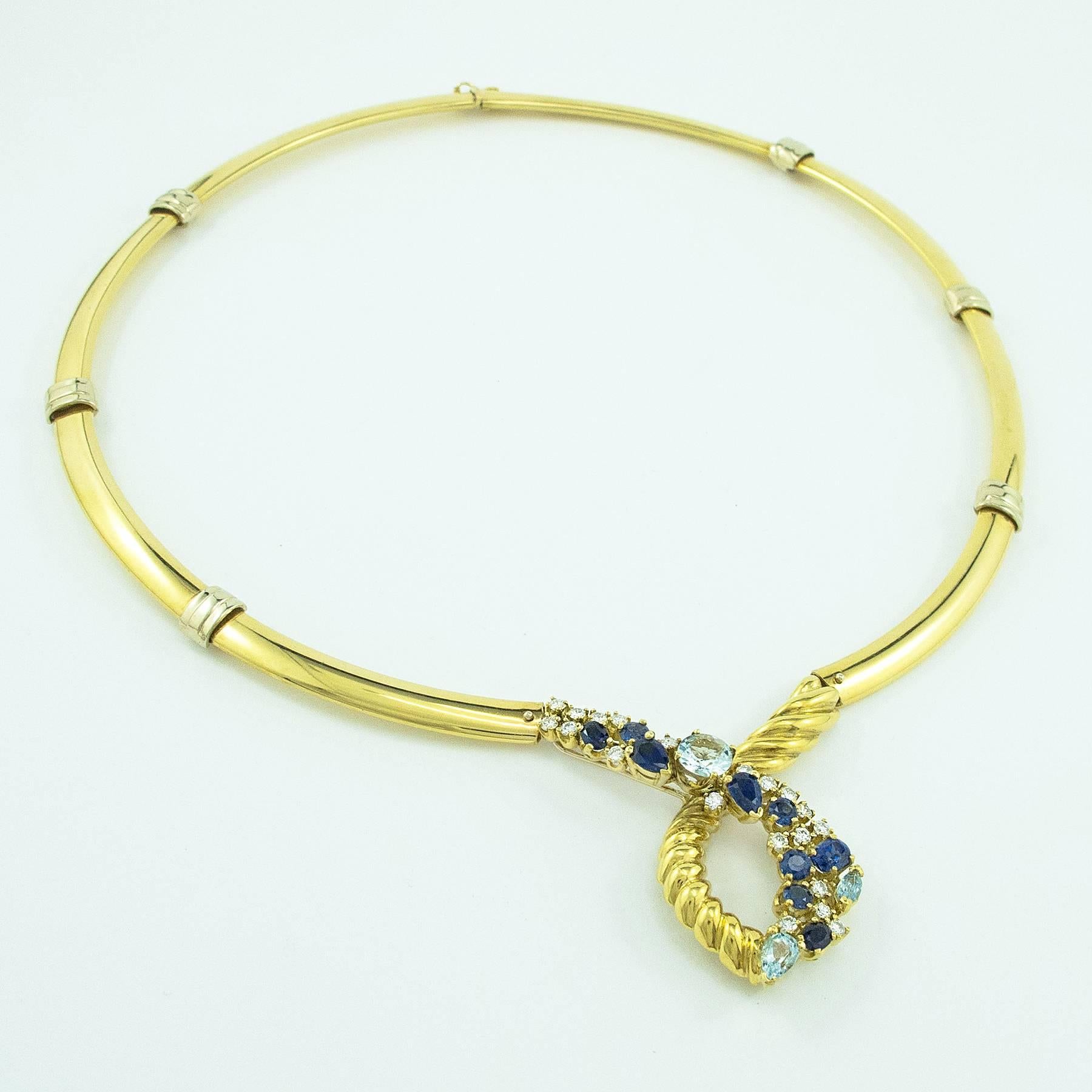 A Beni Sung Aquamarine, Diamond and Sapphire Necklace. This beautiful necklace was designed and hand crafted by the late Beni Sung in 18K yellow gold, set with natural Blue Sapphires, Diamonds and Aquamarines.

The piece is comprised of 8 fitted and