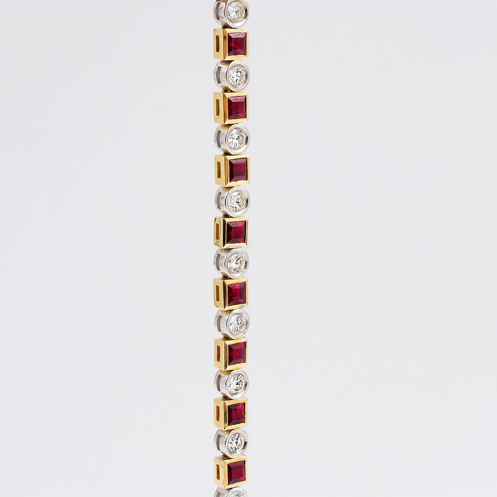 This gorgeous bracelet contains 17 Rubies (natural Corundums) square cut and bezel set in 18k yellow gold. The Rubies are separated by 17 round, brilliant cut Diamonds set in 18k white gold Collets.

The bracelet is flexible and sits beautifully on