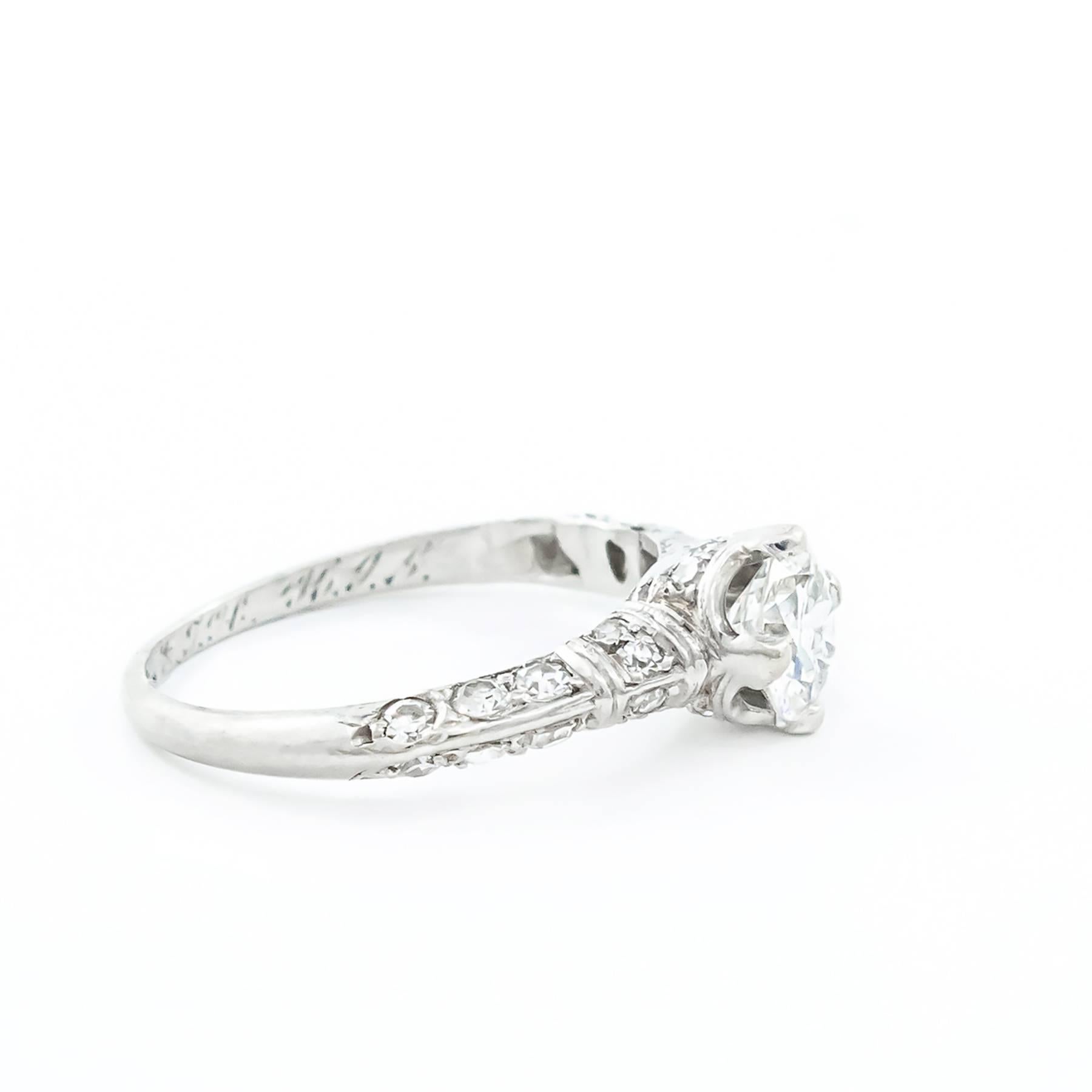 A beautiful Art Deco Platinum Diamond engagement ring. This classic ring is set with a total of one carat of VVS-VVS2 Diamonds. Custom crafted, milgrain and exquisitely detailed by Birks of Canada.

The unique and elegant mount features 26 round,