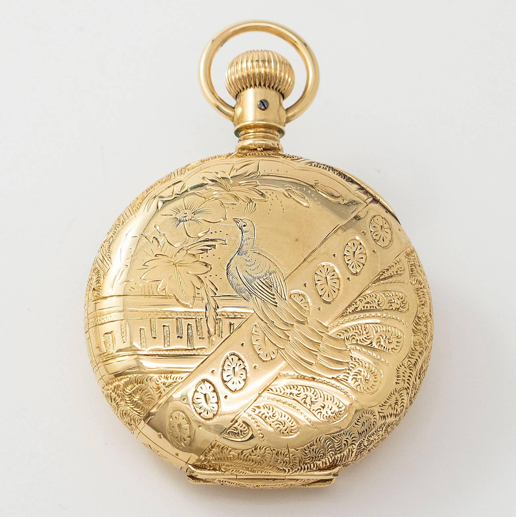 This rare 19th century full Hunter Agassiz Pocket Watch is lever set with a high grade movement. The 14K solid gold case is beautifully embossed and deeply engraved.

White Porcelain Face. Black Roman Numerals. Blue Steeled Target Spade Hands.