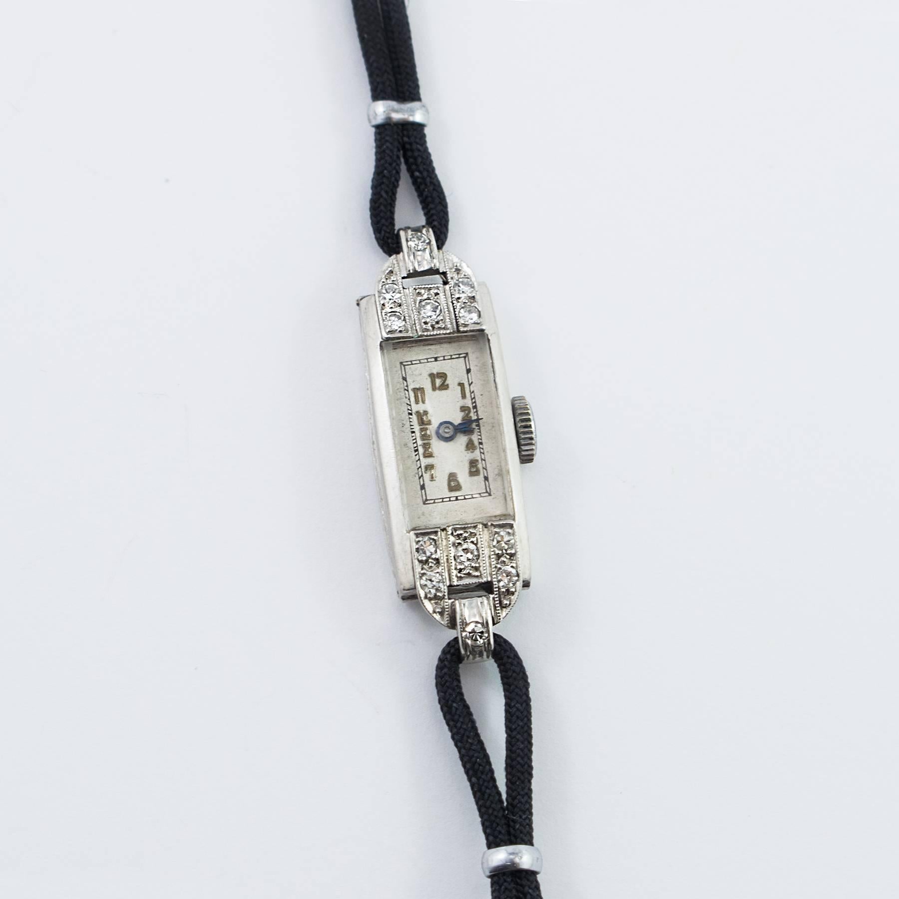 A simply elegant Art Deco Ladies Platinum Diamond Wristwatch. Set with 12 round, brilliant cut Diamonds, totaling .55 carat by gauge and formula.

The case measures 30mm long lug to lug x 12mm wide, excluding the winding stem. Silvered white dial,