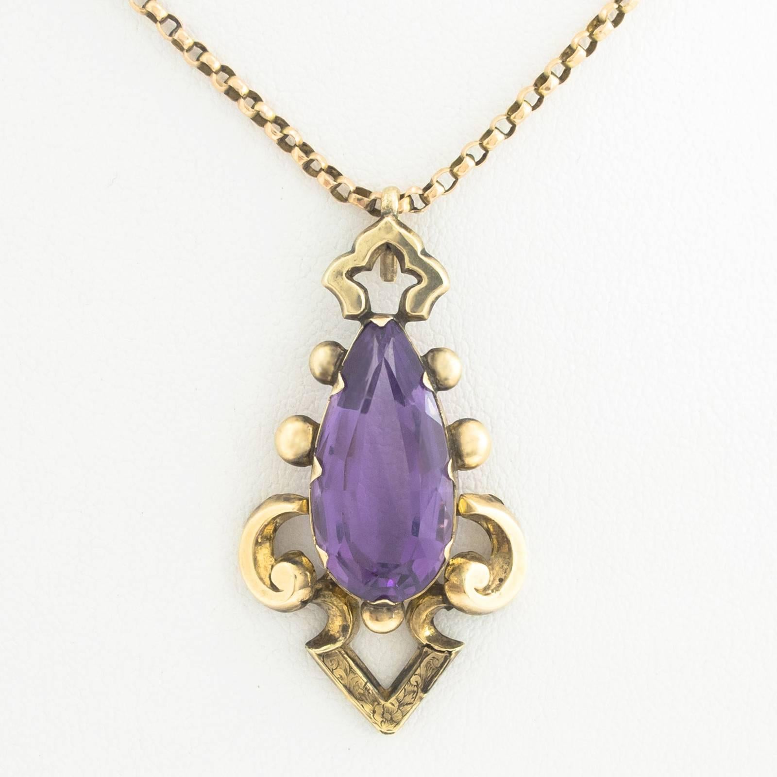 This gorgeous pendeloque cut and faceted Amethyst gemstone is large at a full inch long. It is set in a hand crafted nicely detailed red gold mount with delicate chasing. The finished pendant measures 1.75 inches long x 0.50 inch wide.

Pendeloque