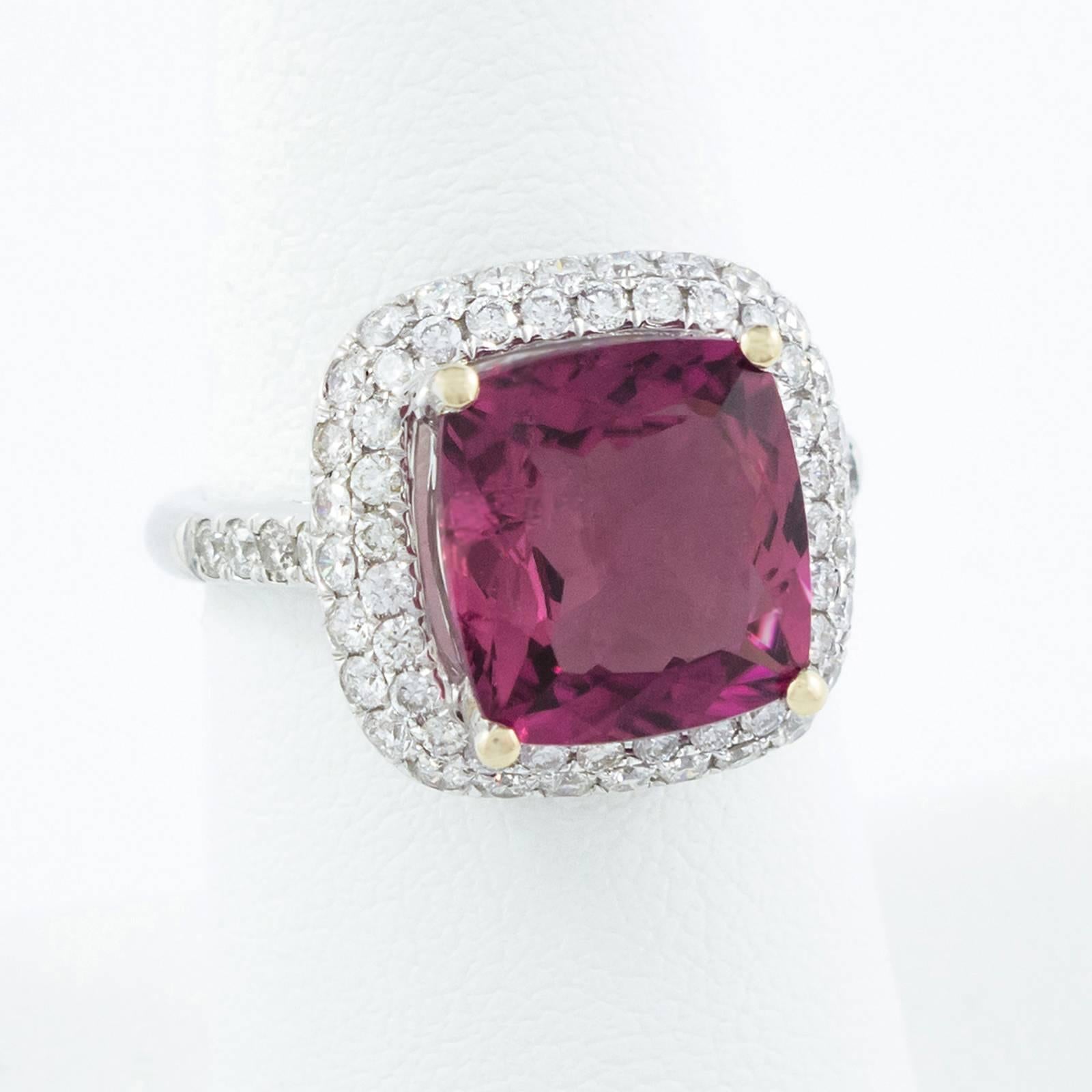 This gorgeous cushion cut Tourmaline is square, and set within a double diamond surround of 66 VS Diamonds.

The top of the ring measures 15mm x 15mm and rises 9mm up off the finger top. Currently a size 7, we will be happy to custom size this ring