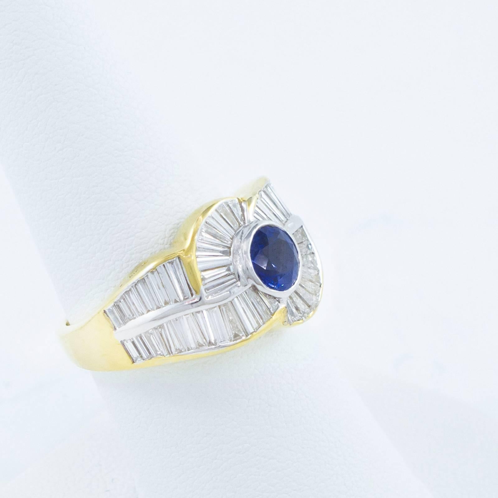 A stunning 7.92 Carat Diamond and Sapphire ring is comprised of sixty-one VVS, invisibly channel set Baguette Cut Diamonds surrounding one beautiful collet set round, Mixed Cut Blue Sapphire in this contemporary, custom crafted 18 Karat yellow and