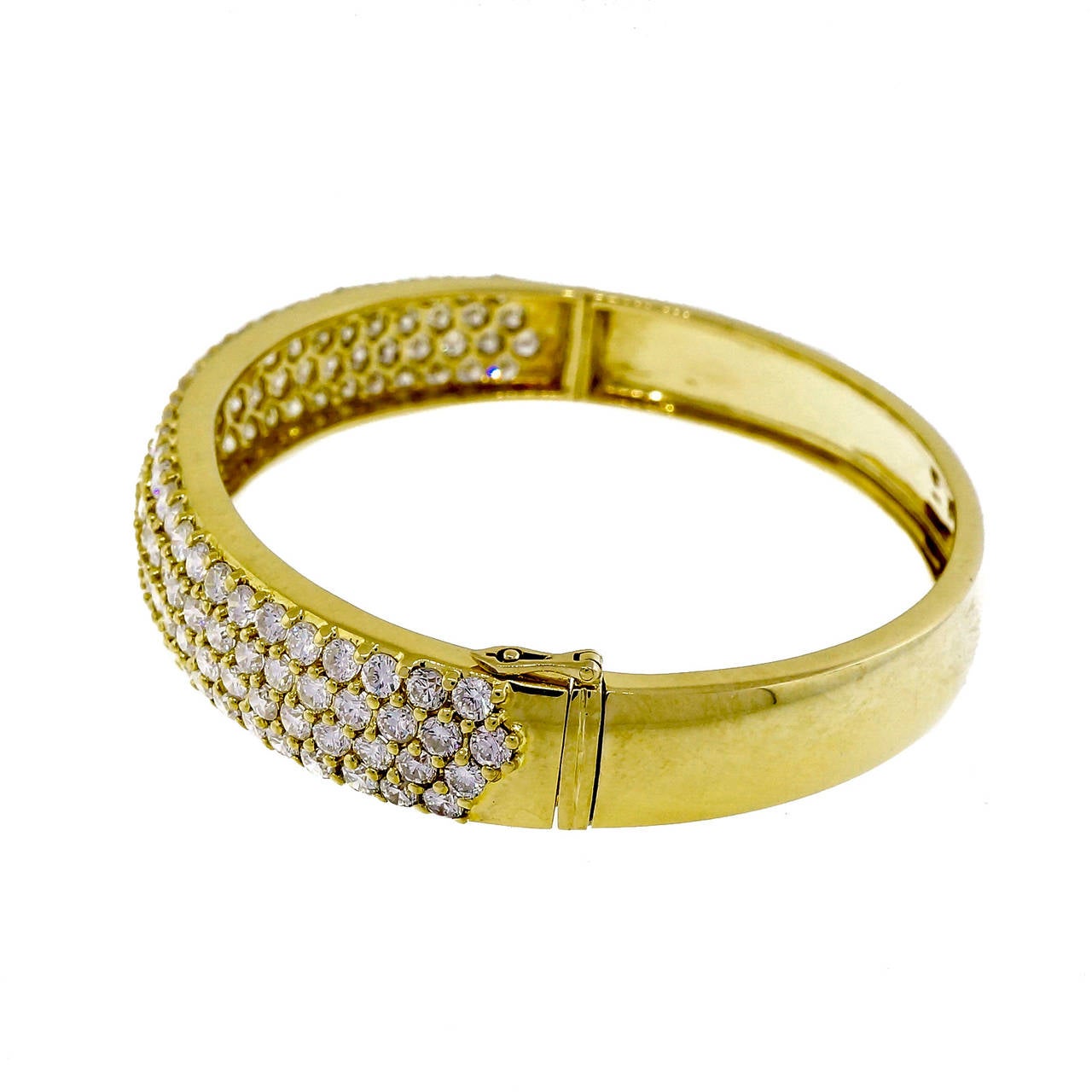 Bold and beautiful 1960’s high grade solid 18k gold bracelet bangle style with bright sparkly full cut diamonds.

126 full cut diamonds, approx. total weight 4.00cts, G-H, VS2 – SI1
18k yellow gold
30.4 grams
Tested: 18k
Stamped: 750
Width at