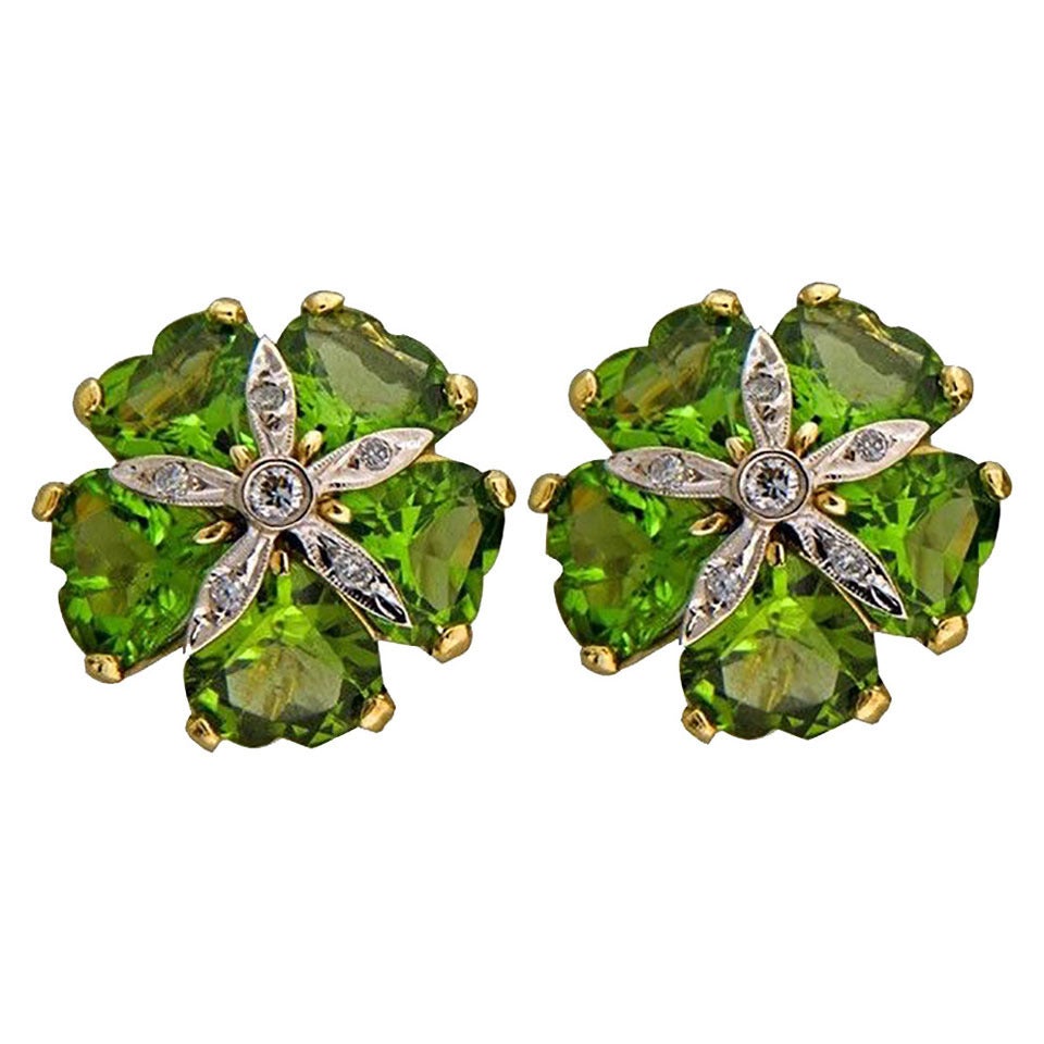 Handmade 18k greenish yellow gold omega clip back and post earrings with Peridot and bright white diamonds. 

10 top gem color heart shaped genuine Peridot 9X9mm approx. total weight 15.00cts
12 full cut diamonds approx. total weight .16ct, G,