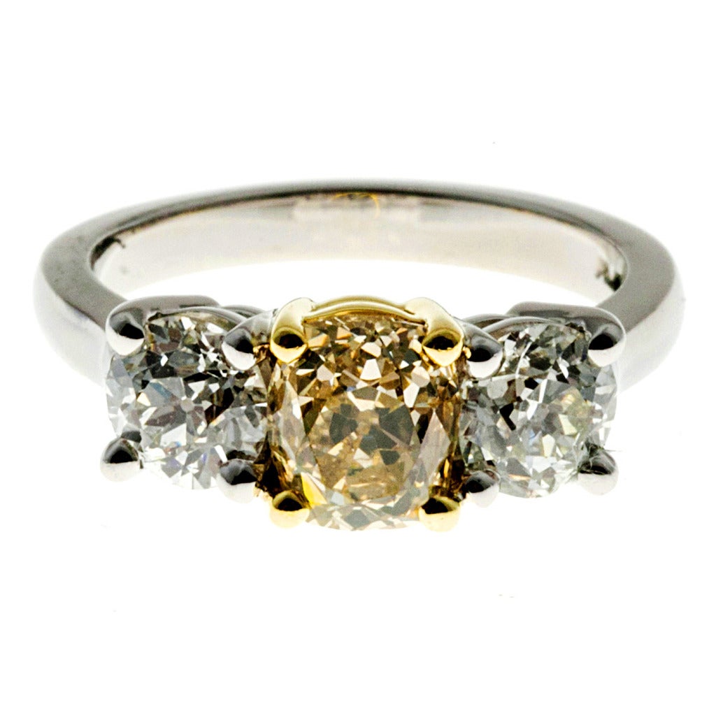 Peter Suchy 2.78 Carat Three-Stone Fancy Yellow Diamond Platinum Engagement Ring. Yellow center diamond with two side diamonds in a platinum setting. EGL Certified, 

1 Center diamond is certified, 1.44ct Natural fancy light to fancy yellow, SI2.