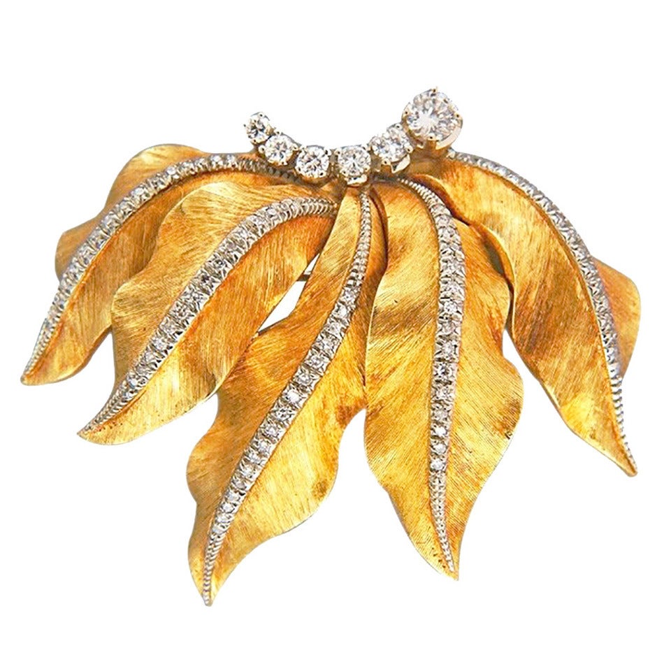 Classic 1950s Diamond hand textured 3-D 18k yellow gold Brooch.

1 full cut diamond, approx. total weight .25ct, G, SI1
5 full cut diamonds, .04ct to .07ct, approx. total weight .37cts, G, SI1
Stamped: CR or GR Blum Italy K 18
18k yellow gold
18.8
