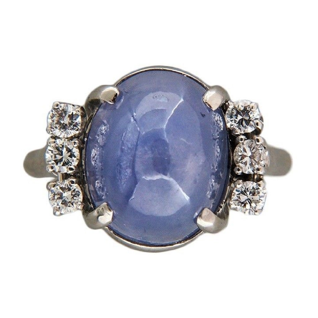 All original 1940's hand made platinum ring with a high dome cabochon natural light slightly purple translucent star Sapphire. Very bright sharp star. The star lights up the whole interior of the stone.

1 Oval cabochon translucent blue star