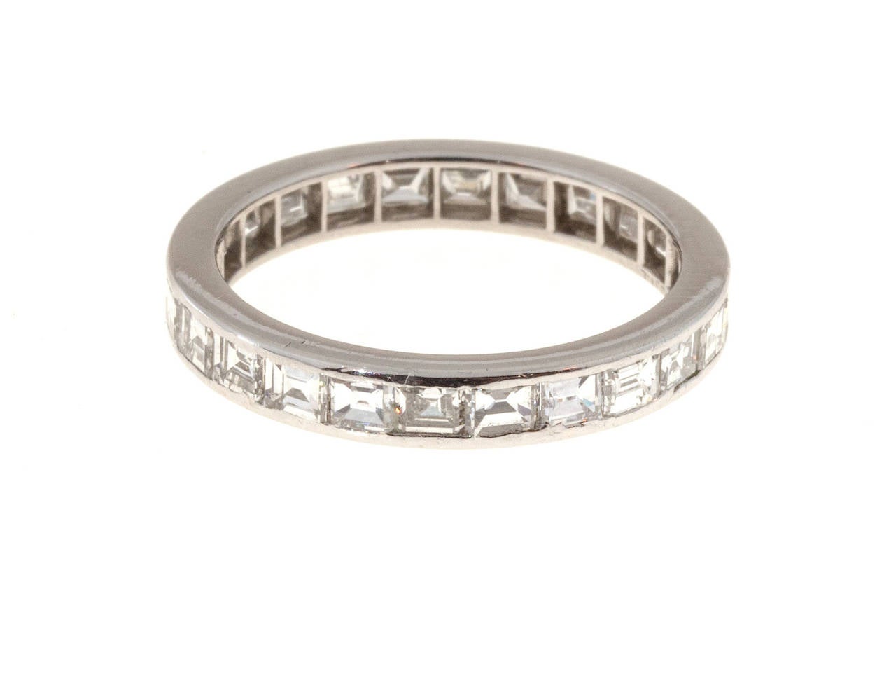 Original 1942 Tiffany & Co. platinum square diamond Eternity ring from 1942 set with F, VVS diamond.

24 square diamonds, approx. total weight 2.70cts, F, VVS
Stamped: Tiffany & Co Plat
3.2 grams
Tested: Platinum
Engraved on side: Oct 14,