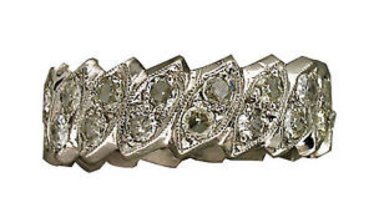 Platinum eternity band. Made with leaf shaped sections designed at an angel set with 2 transitional cut diamonds per section.

34 transitional cut diamonds approx. total weight 1.75cts, G-H, VS-SI
Platinum
Tested: Platinum
5.9 grams
5/16 x 7/8