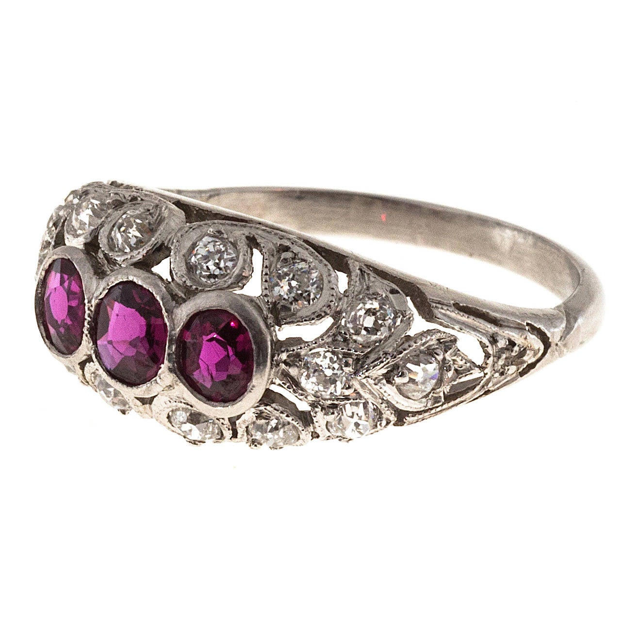 Bright red certified natural Ruby and diamond dome ring. Edwardin their original 1910 dome ring. 3 rubies surrounded by 16 diamonds in a platinum setting. 

3 old European cut natural bright gem pure red Rubies, approx. total weight .75cts, VS-SI,