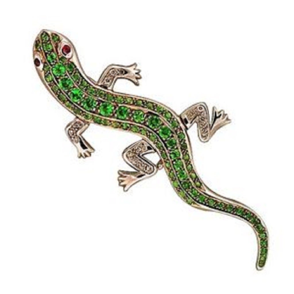 Wonderful friendly lizard 14k white gold pin with moveable legs set with diamond feet, Ruby eyes and bright green Tsavorite Garnet body.  Beautiful design top quality workmanship and material.  One of the best and cutest lizard pins we have ever