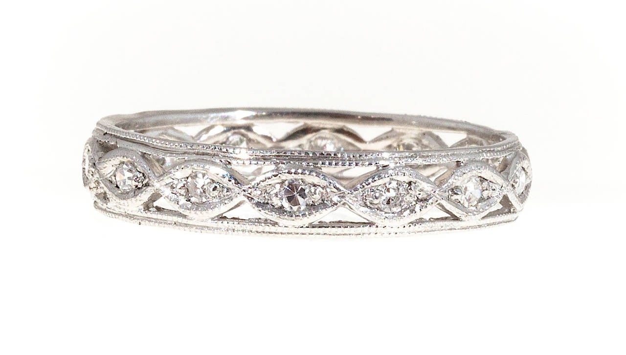 Original wide Platinum Eternity ring with diamond all around. Delicate bead work.

14 round single cut diamonds, approx. total weight .20cts, F, VS
Platinum
3.4 grams
Stamped: 980
Width: 4.2mm
Height: 1.5mm
Size 9 and sizeable