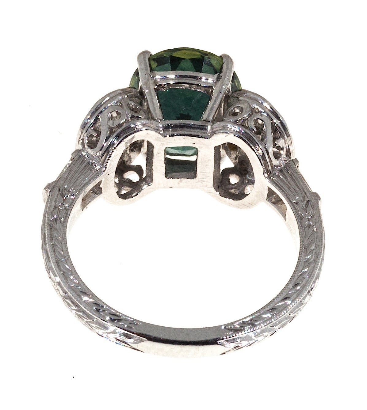 Natural no heat untreated green Sapphires over 3.00cts are incredibly rare. This one is GIA certified all natural no heat 4.21ct bright green with a blue overtone. Large surface area. The stone is in a unique pave diamond ring with baguettes in