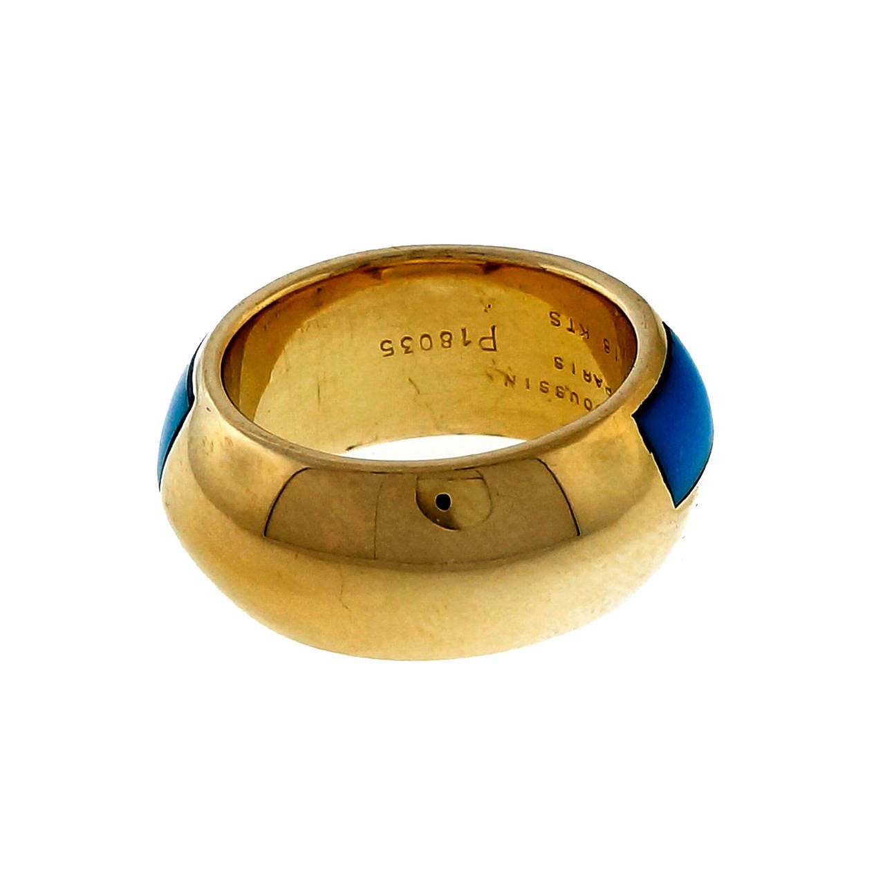 Fantastic design from one of the world’s finest jewelers Mauboussin Paris. Bright blue natural inlaid Turquoise, circa 1990

5 inlaid Turquoise 8.90 x 4.35mm
18k yellow gold
11.9 grams
Tested and stamped:  18k
Hallmark: Mauboussin Paris