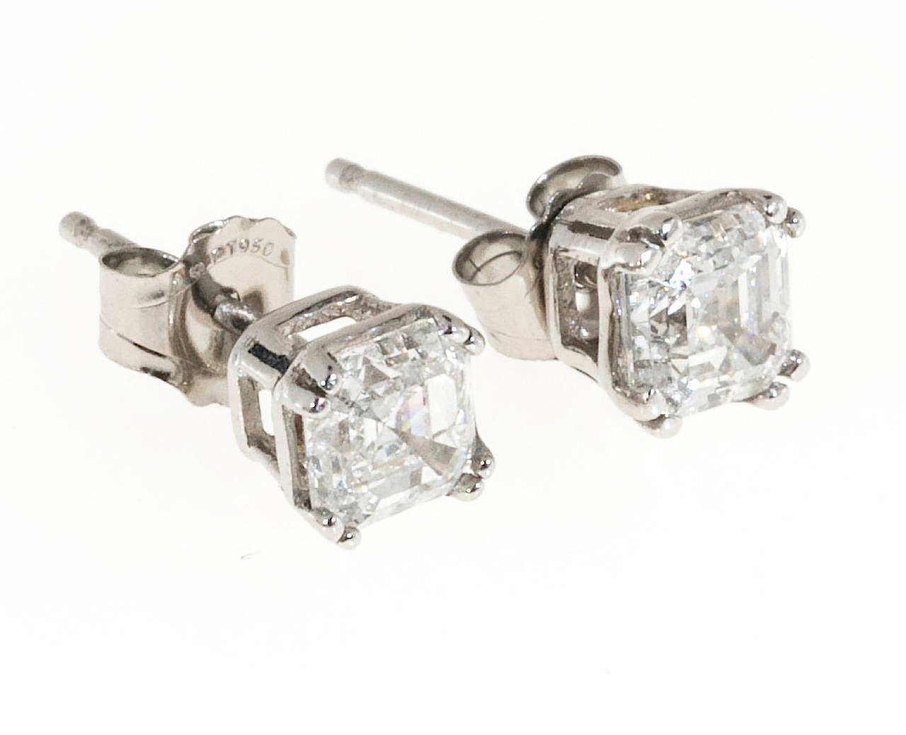 Asscher cut diamond studs.should look like. Distinct repeating faceting visible from every angle. Small table, raised crown. Cut off corners, handmade Platinum. Double prong setting to show off the G, VS diamond. The settings are brand new. The