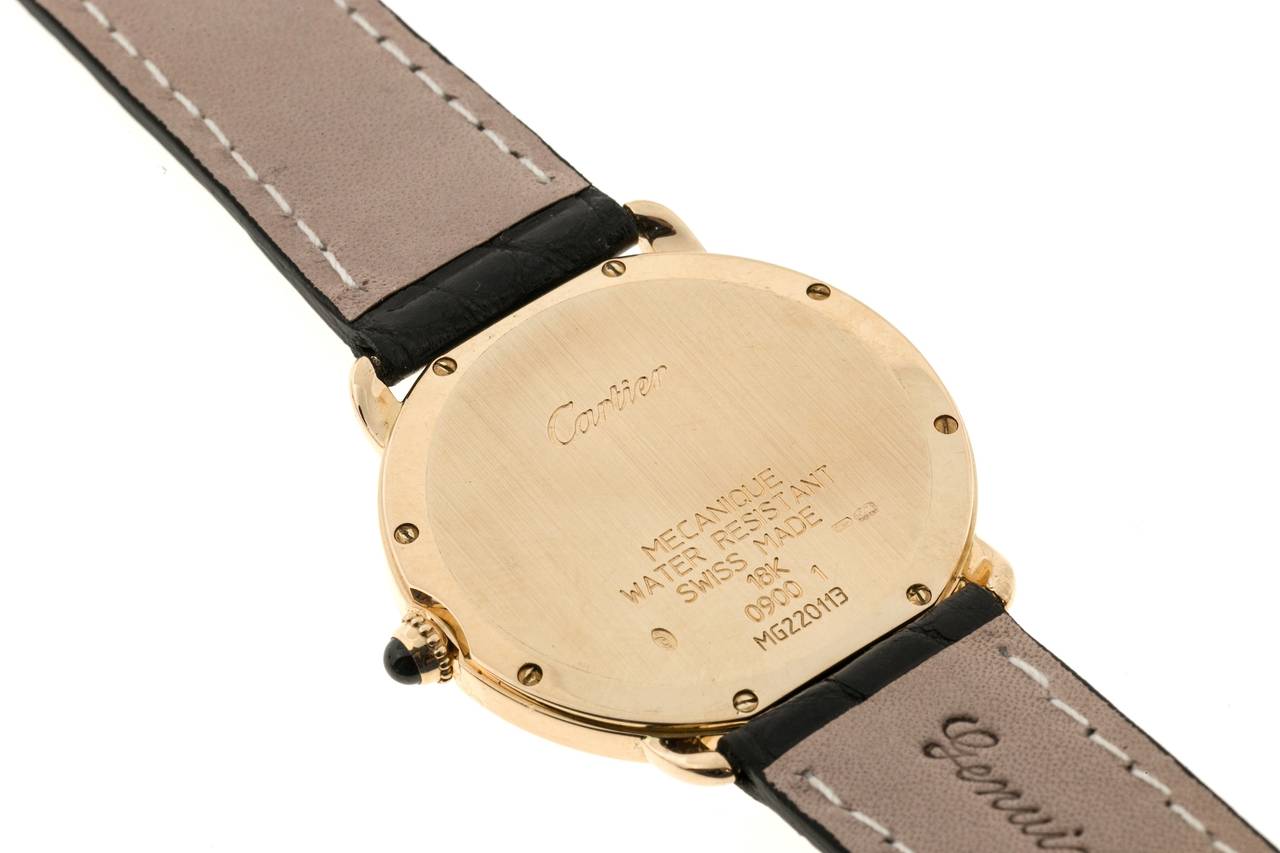 Authentic men’s Cartier Ronde Louis Mecanique in 18k yellow gold with new Alligator strap and original Cartier 18k Deployant buckle. Ivory and black guilloche dial with Roman Numerals and 24 hour markings.

18k Yellow Gold
Length: 35.32
Width: