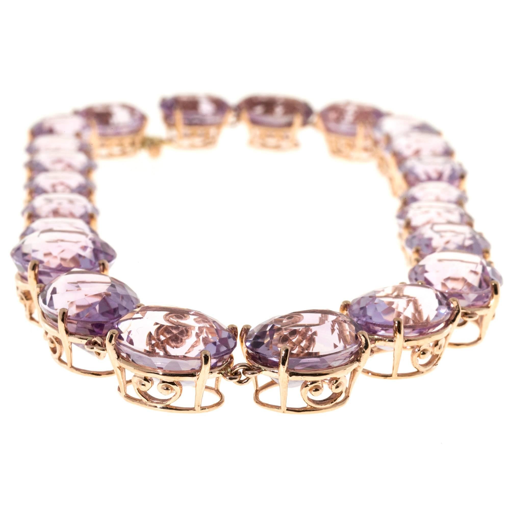 Lilac purple untreated Amethyst Riviere Necklace. The stones are natural and slightly different shape and depth. Rose gold settings were made for each stone in the original style of scroll basket. All Amethyst were re-polished. A Bracelet is