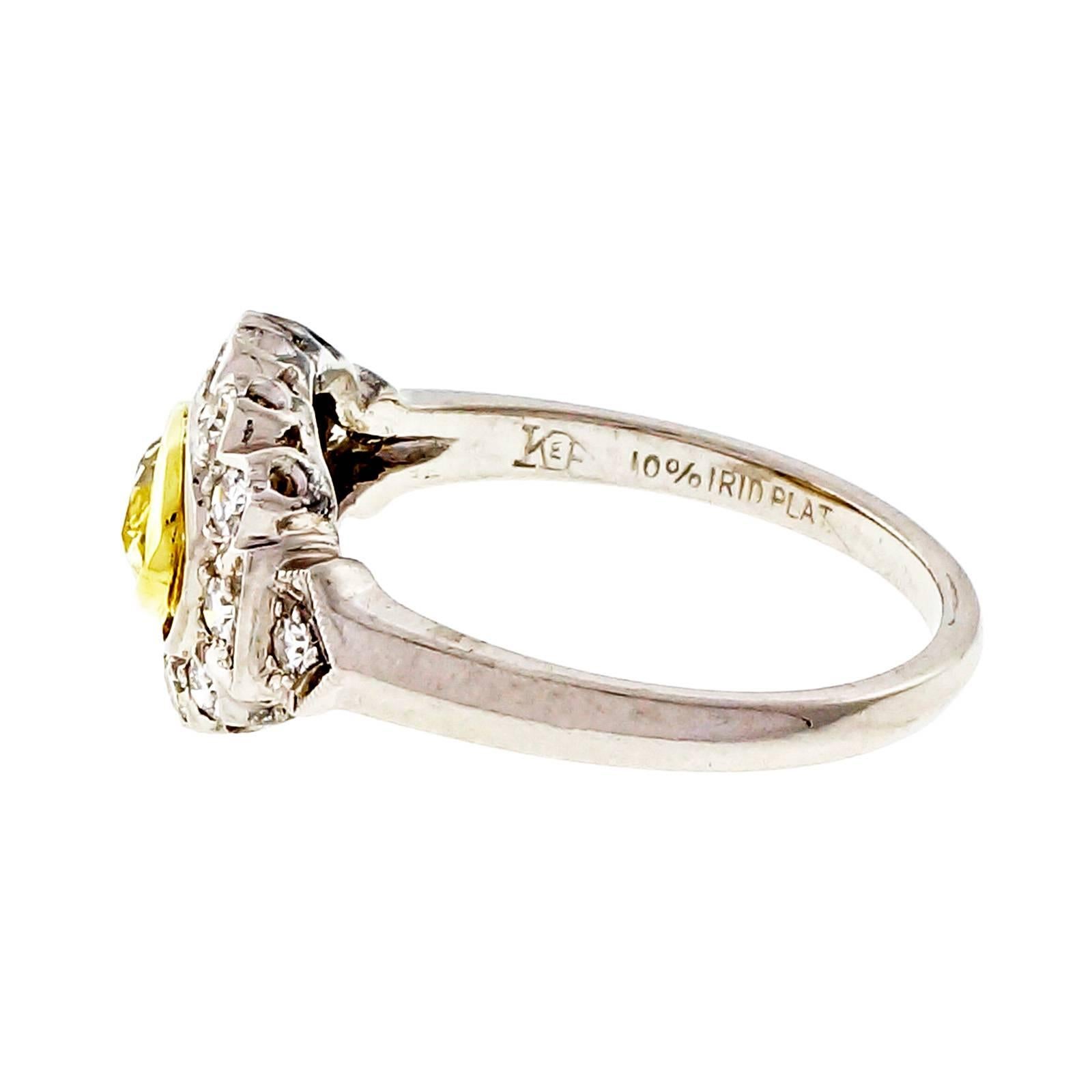 Fancy intense natural yellow GIA certificate diamond Marquise shape in its all original Platinum 1940’s engagement ring. Sits across the finger. Bezel set low. Surrounded by white diamonds.

1 Marquise fancy intense yellow diamond, approx. total