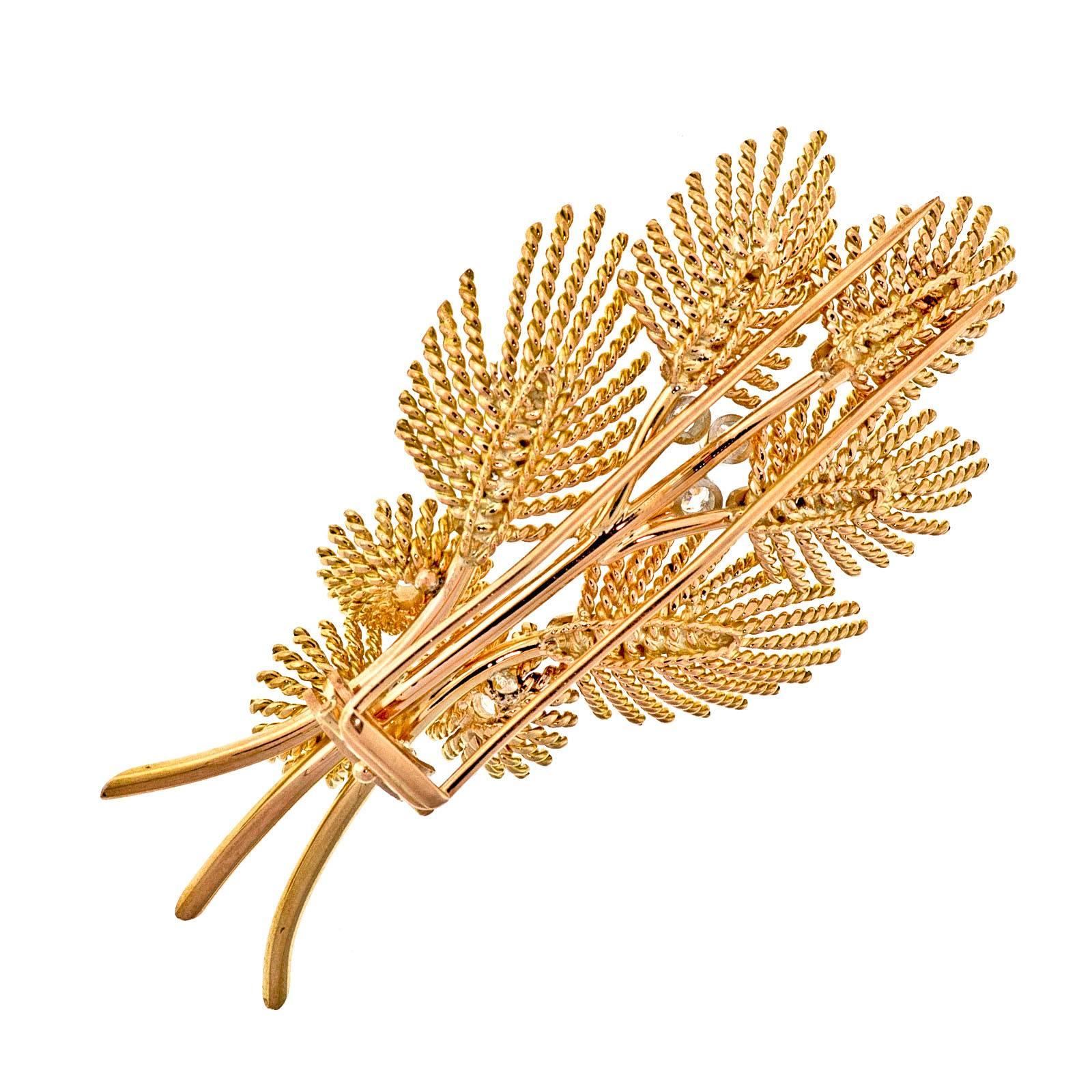 Mid-Century 1950's Leaf and diamond brooch. Handmade 18k yellow gold and platinum handmade flower brooch with diamonds along the leaf's in platinum inlays. Rose gold double clip back.

6 round full cut diamonds, approx. total weight .48cts, G – H,