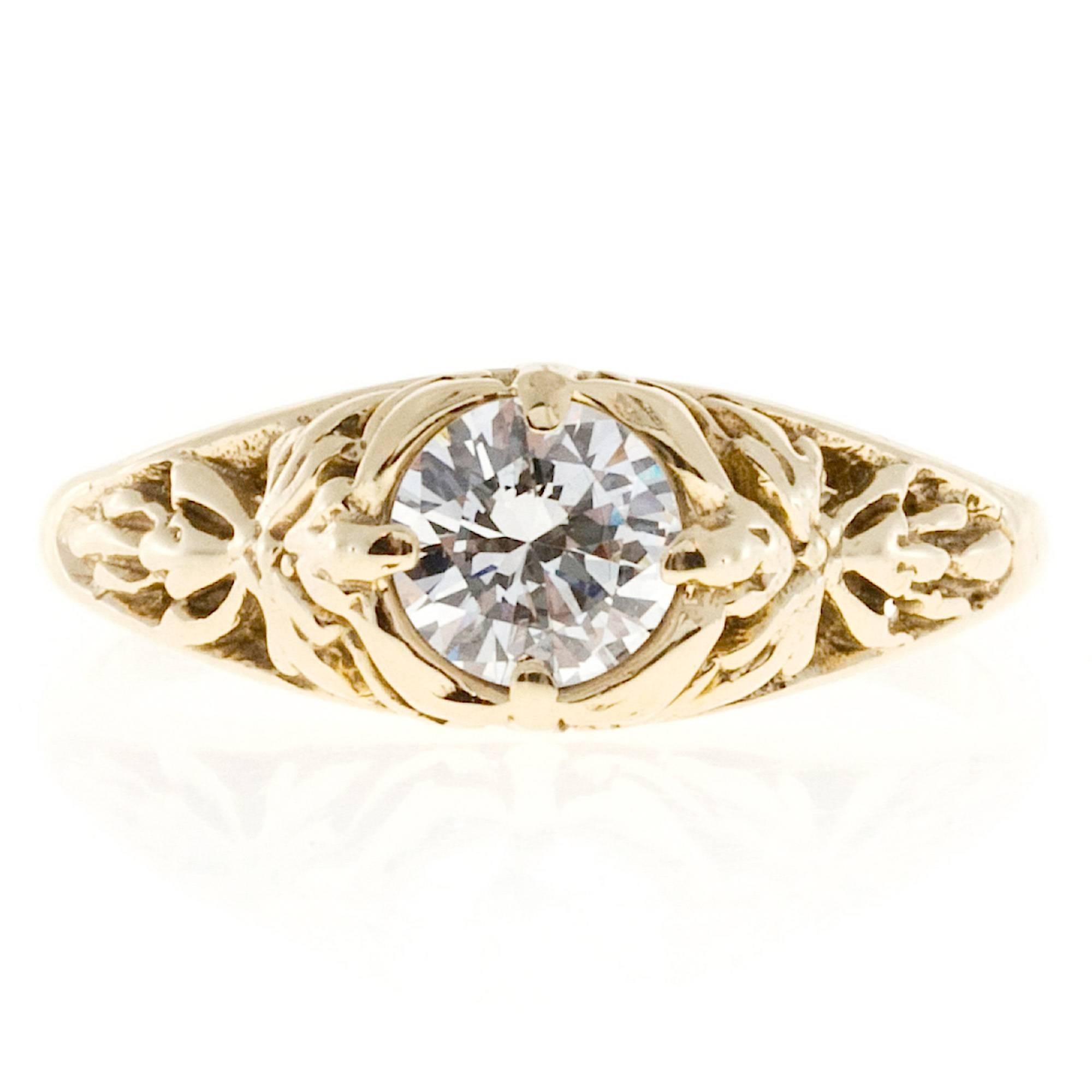 Estate filigree 14k yellow gold engagement ring with a transitional cut extra high grade round diamond. .

1 round diamond, approx. total weight .43cts, E – F, VS2, 
14k yellow gold
Tested: 14k
2.0 grams
Width at top: 6.45mm
Height at top: