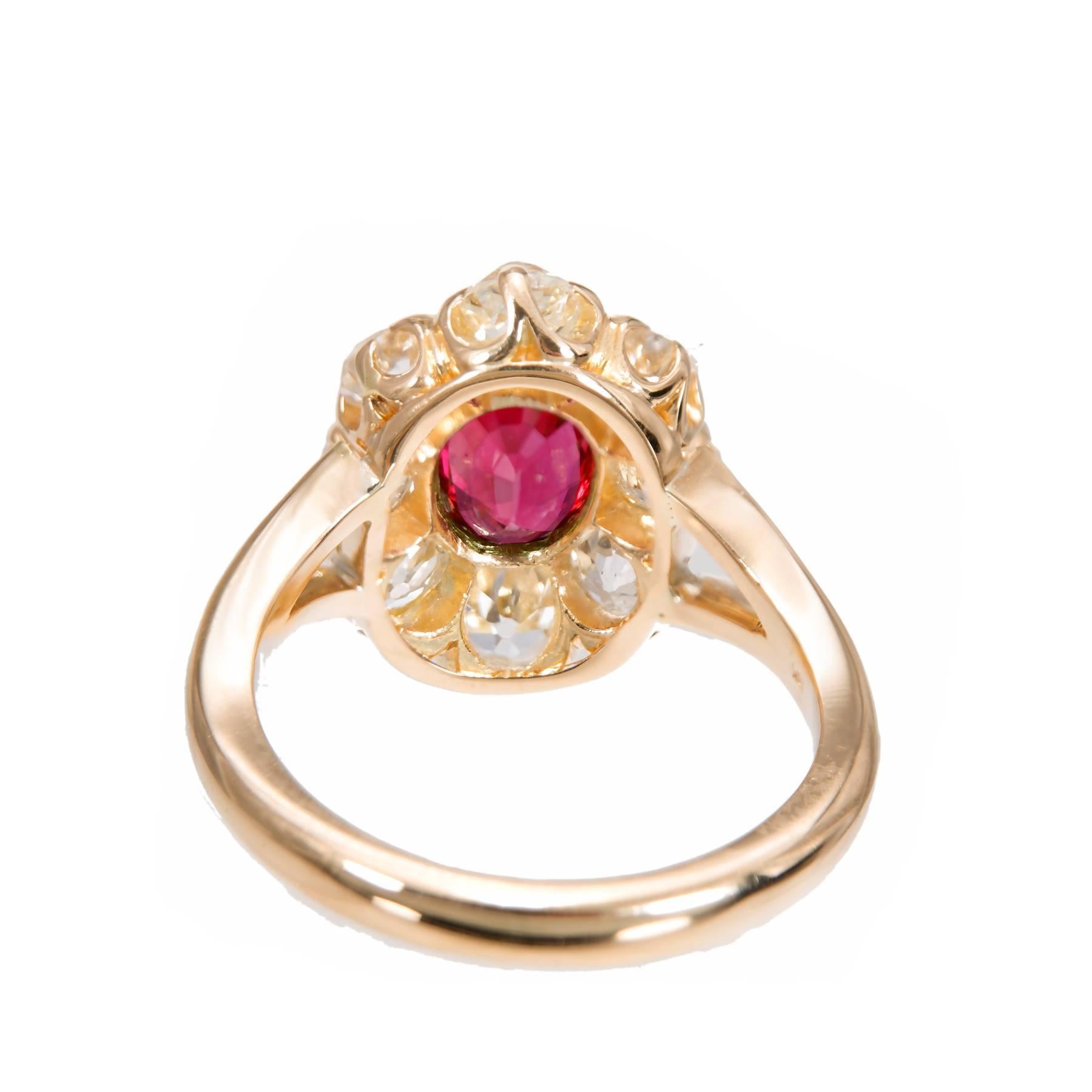 Natural no heat Ruby engagement ring. GIA certified center oval ruby with a halo of 8 old mine cut diamonds in a 18k yellow gold setting. Created in the Peter Suchy Workshop.  

1 oval top gem red Ruby, approx. total weight 1.17cts, SI , natural no