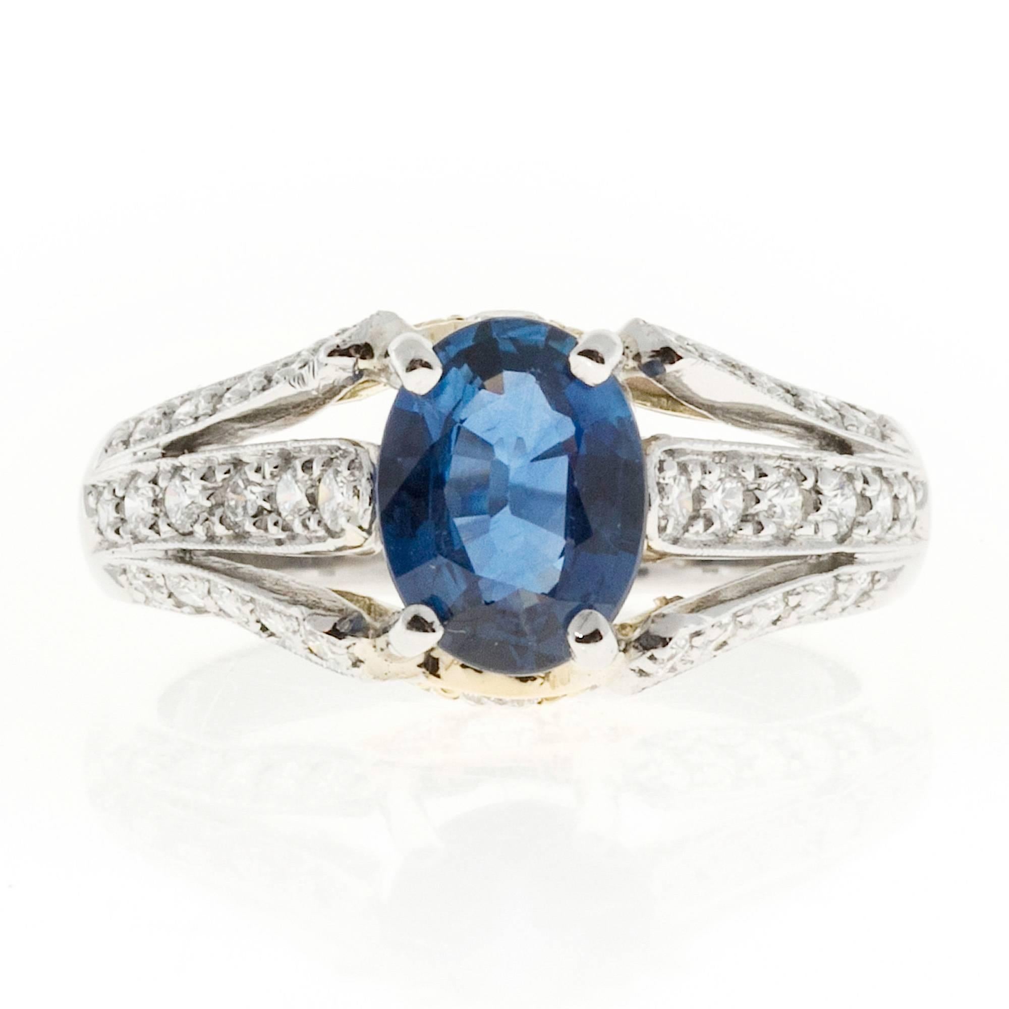 Richard Krementz Custom made top gem bright blue Sapphire and diamond engagement ring in Platinum with 18k yellow gold.  

1 oval gem blue Sapphire, approx. total weight 1.28cts, simple heat only, GIA certificate #2171426206
38 round diamonds,
