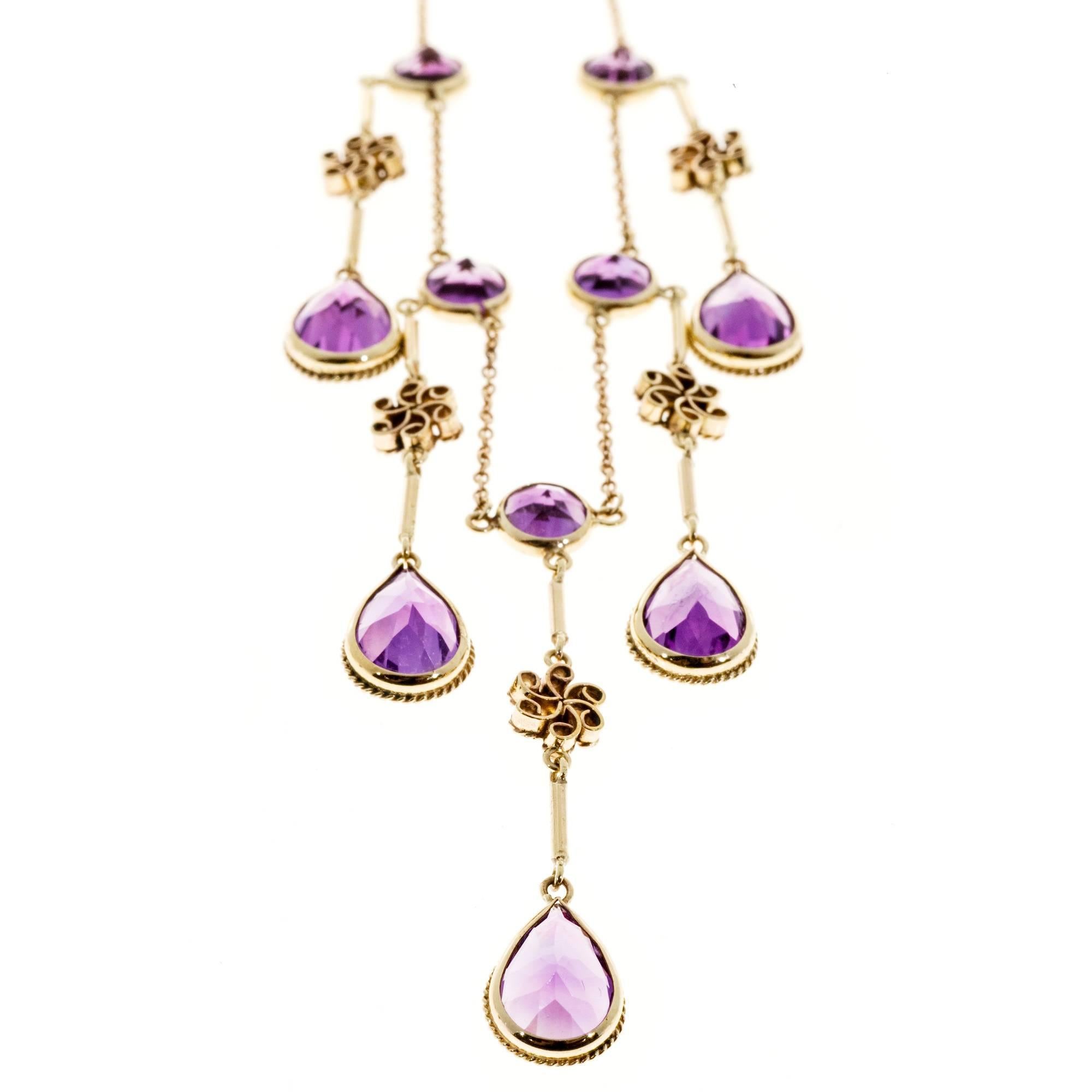 Amethyst Chandelier style necklace. Natural patina.  

5 round purple Amethyst, approx. total weight 2.50cts, 5.47mm
5 pear purple Amethyst, approx. total weight 6.50cts, 9.04 x 6.33mm
9k yellow gold
Tested: 9k
Stamped:  375
7.1