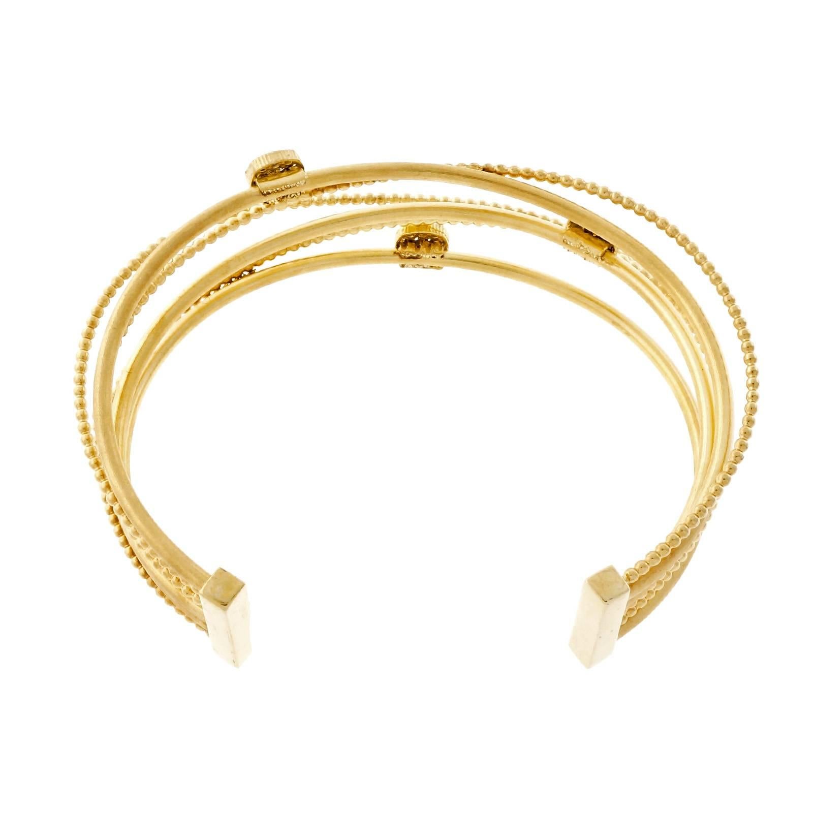 Isaac Reiss Designer slip on diamond 14k yellow gold cuff bracelet.

42 round diamonds, approx. total weight .33cts, H, VS
14k yellow gold
Tested and stamped: 14k
Hallmark: I. Reiss
22.2 grams
Fits a standard 7 to 7 1/2 inch wrist
Inside