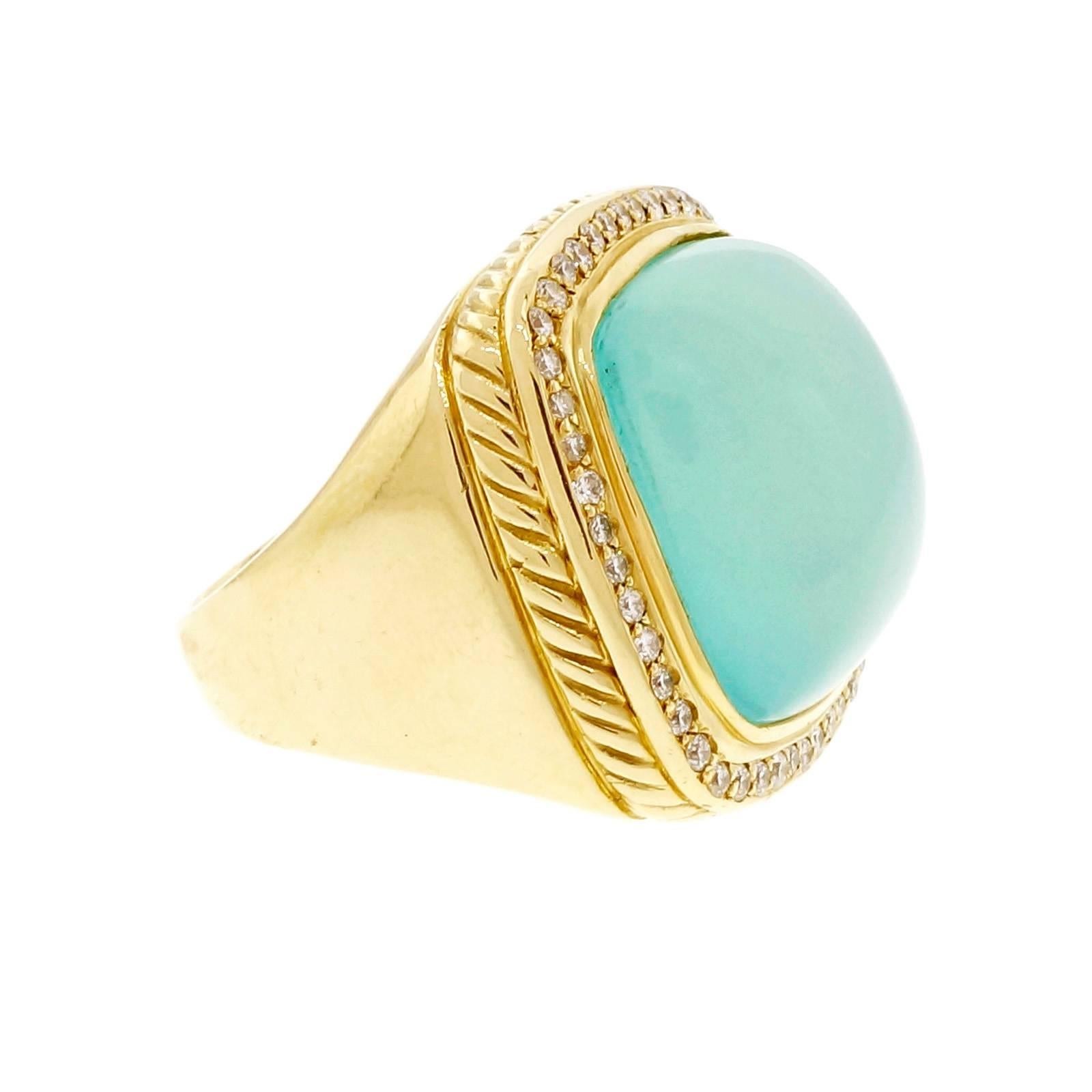 David Yurman bright translucent blue Chalcedony large size cocktail ring with diamond border. 

1 cushion blue Chalcedony, 19.43 x 19.41 x 8.53mm
46 round diamonds, approx. total weight .46cts
18k yellow gold
Tested: 18k
Stamped: