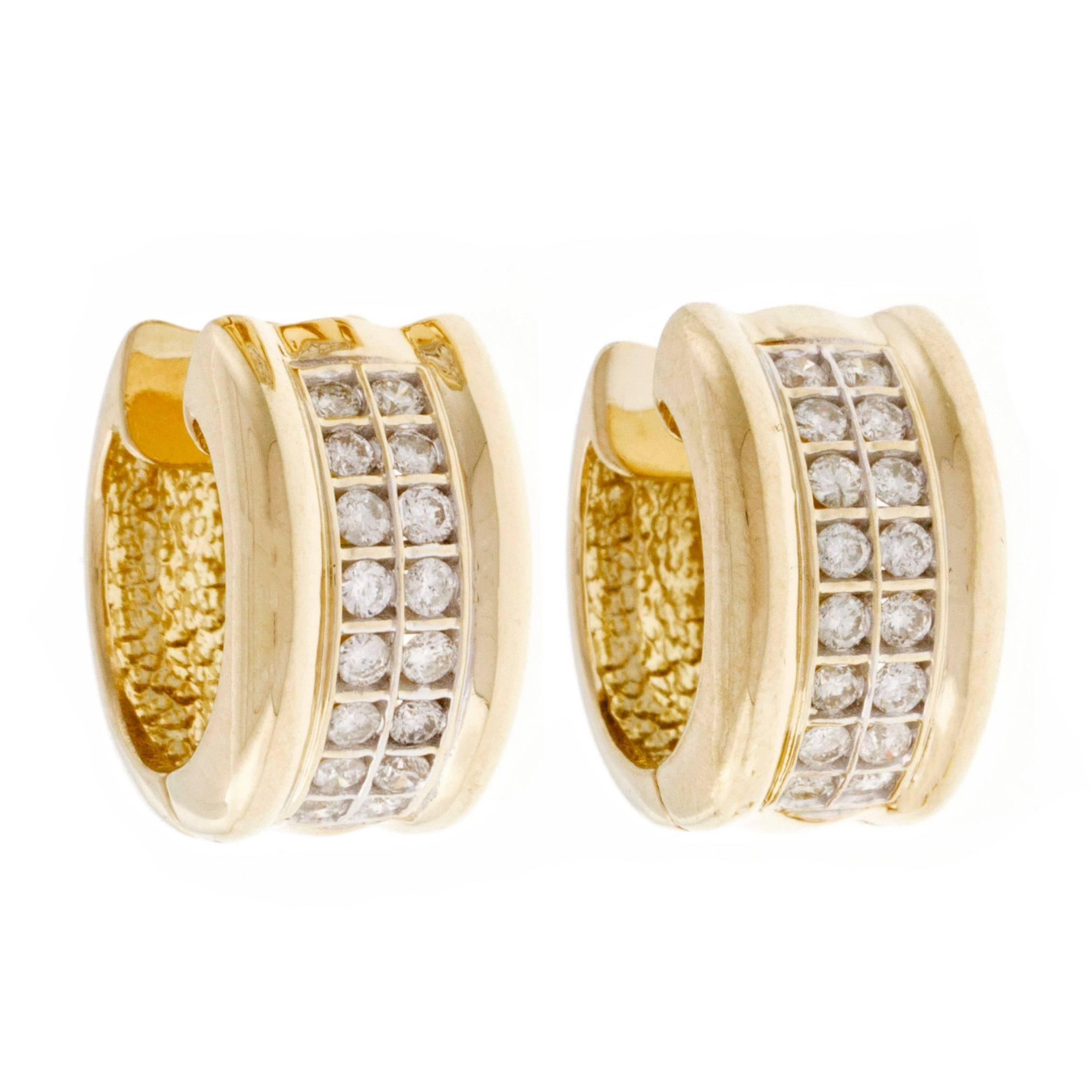 Diamond wide hoop huggie style hinged earrings with two center rows of bright and sparkly diamonds.

32 round diamonds, approx. total weight .70cts, H, SI1
14k yellow gold
Tested and stamped: 14k
13.1 grams
Top to bottom: 17.50mm or .69 inch
Width: