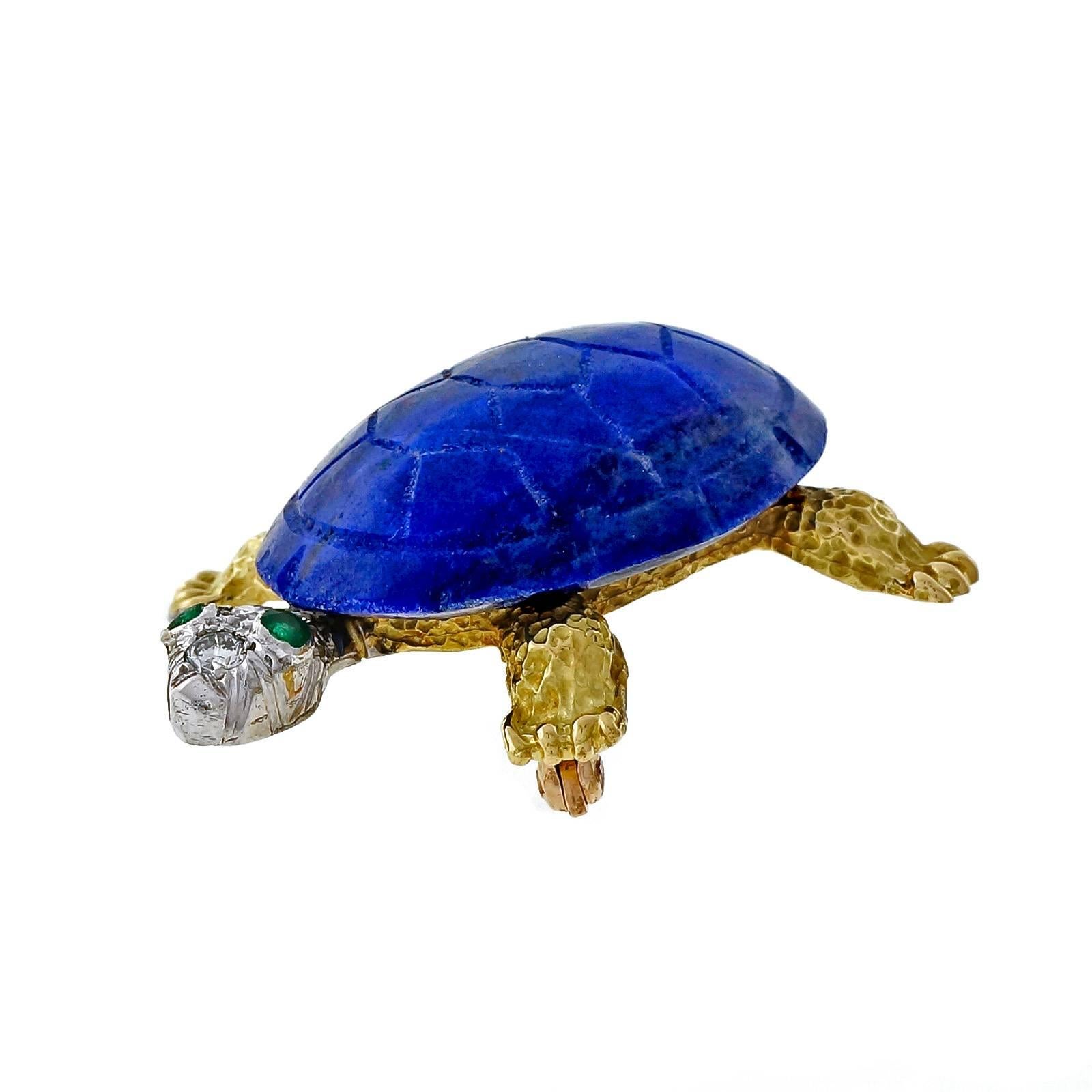 Wonderful 3-D 18k yellow gold Turtle pin with natural Lapis shell, white gold head and yellow gold body. Emerald eyes with diamond head and tail.

1 oval carved blue Lapis 26.92 x 20.70 x 7.20mm
2 round Emeralds, approx. total weight .06cts
9