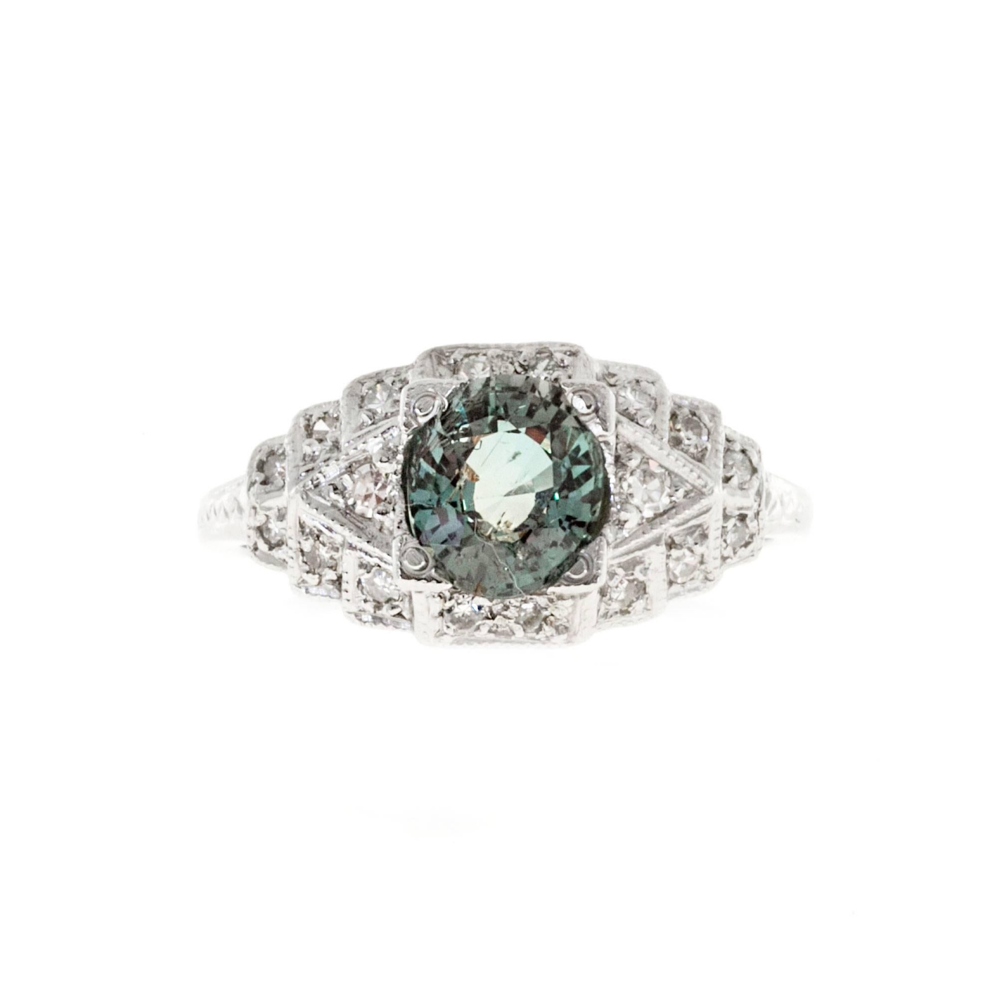 Natural color change Alexandrite vintage 1920 Platinum diamond ring. GIA certified green to pinkish purple color change in different lights.

1 oval green to pinkish purple old cut Alexandrite, approx. total weight 1.25cts, natural no
