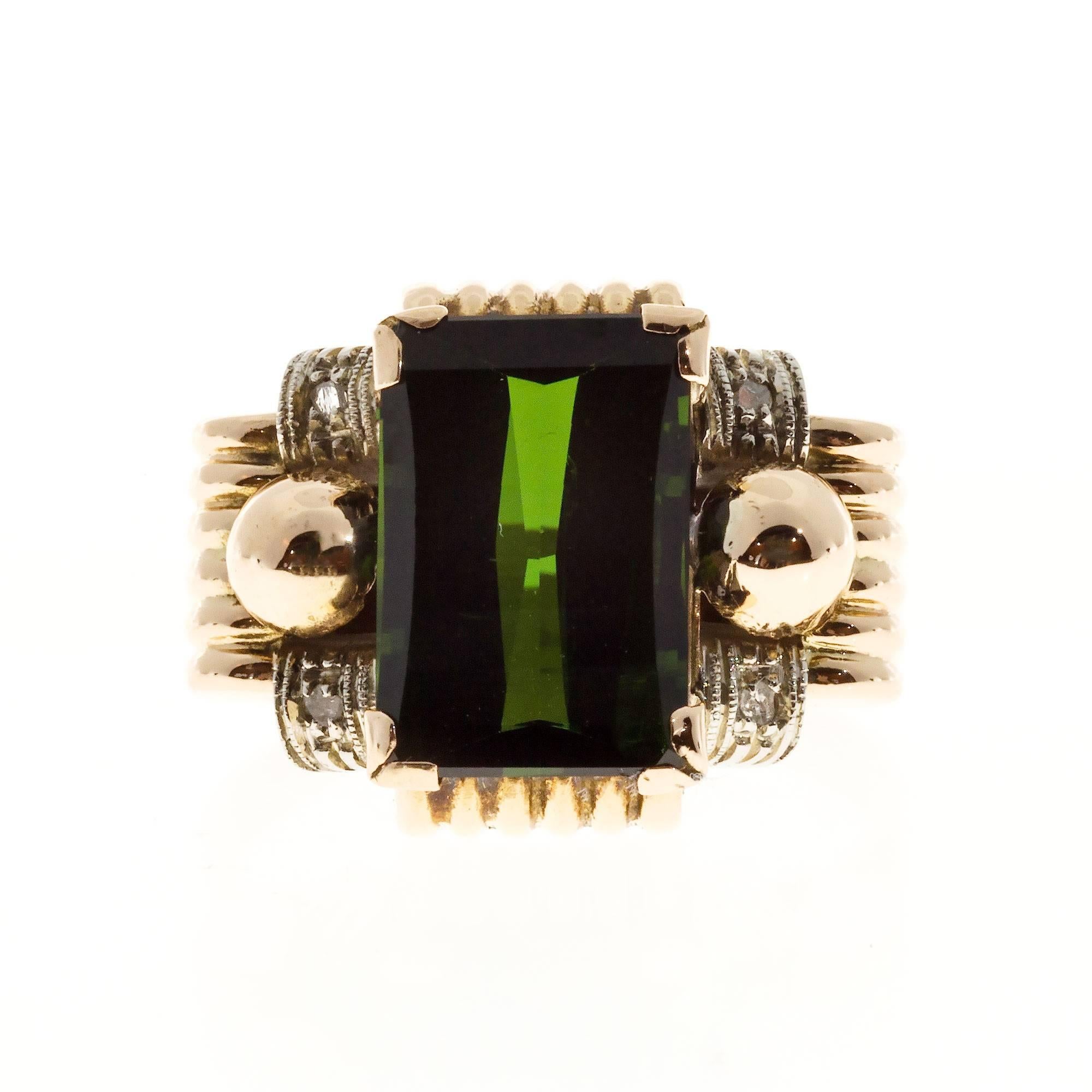 Retro 1940 14k Rose gold ring with white gold diamond accents and a bright deep green roll top Emerald cut Tourmaline.

1 roll top Emerald cut bright green Tourmaline, approx. total weight 6.20cts, SI1
4 rose cut diamonds, approx. total weight