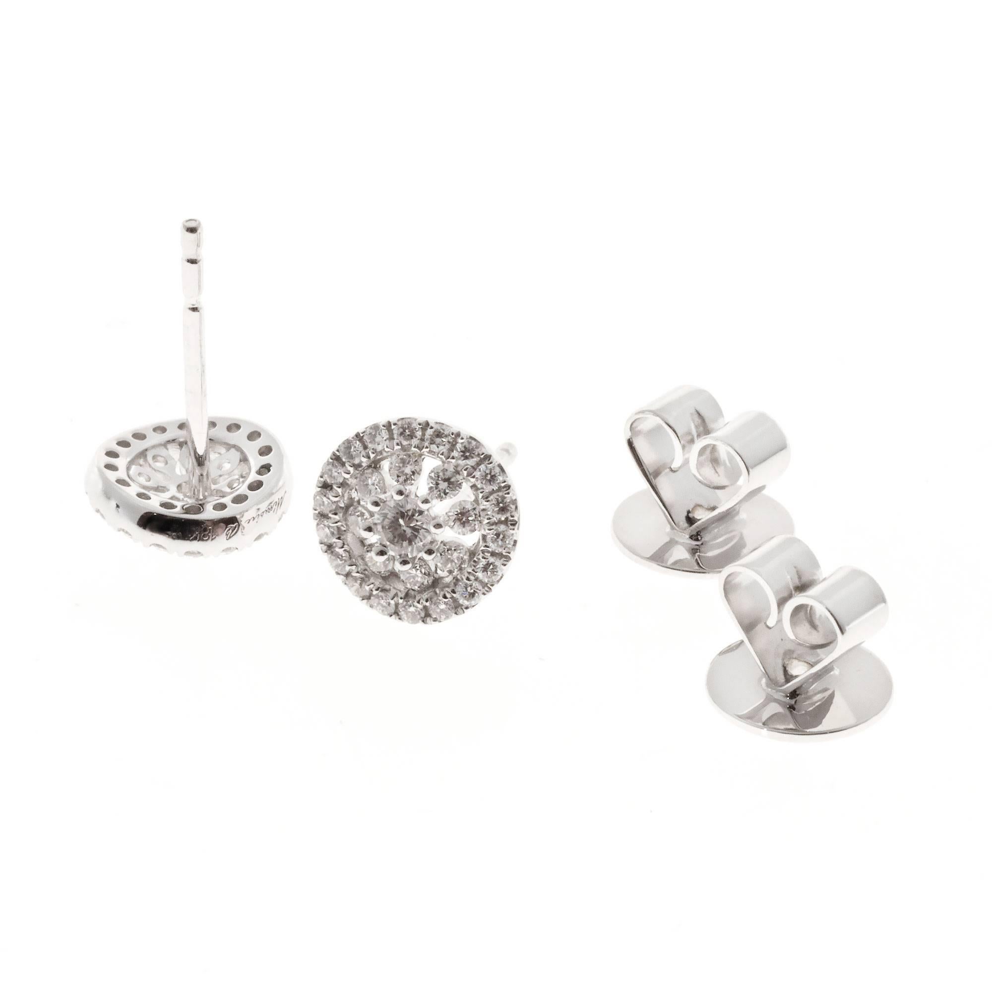 Memoire diamond Bouquets halo earrings. 54 round cut diamonds set in 18k white gold stud settings.

54 round diamonds, approx. total weight .41cts, F – G, VS
18k white gold
Tested and stamped: 18k
Hallmark: Mémoire B 18k .41ct
2.4 grams
Top to