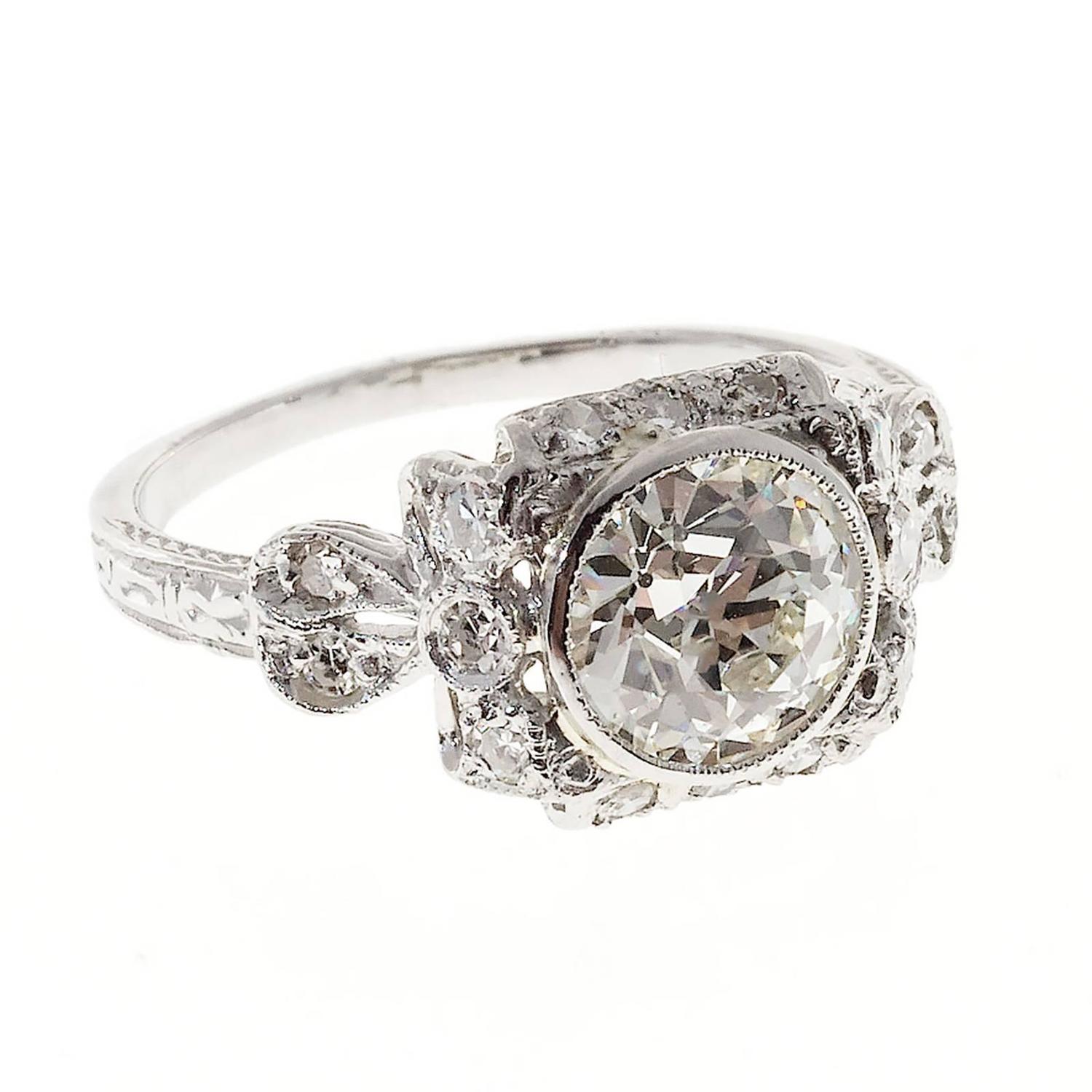 Edwardian Diamond Platinum Bow Design Engagement Ring For Sale at 1stdibs